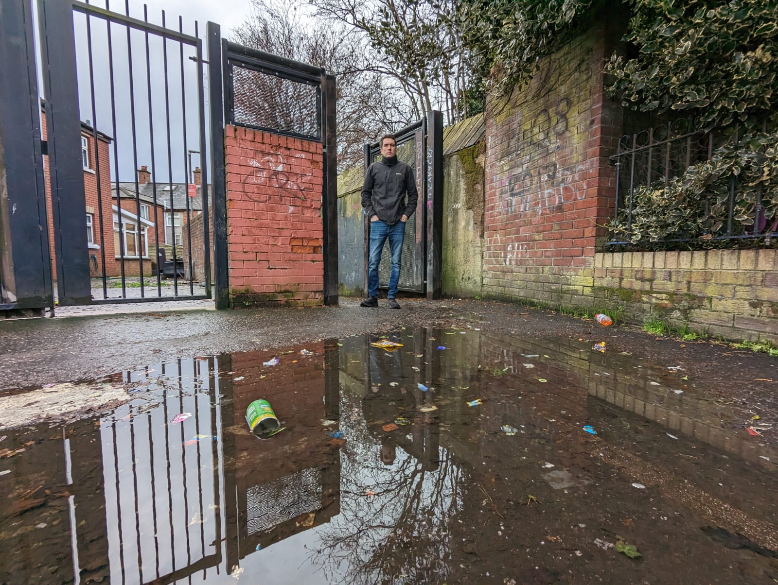 CLEAN-UP: People Before Profit councillor Matt Collins at the alleyway between Beechmount Grove and Mica Drive