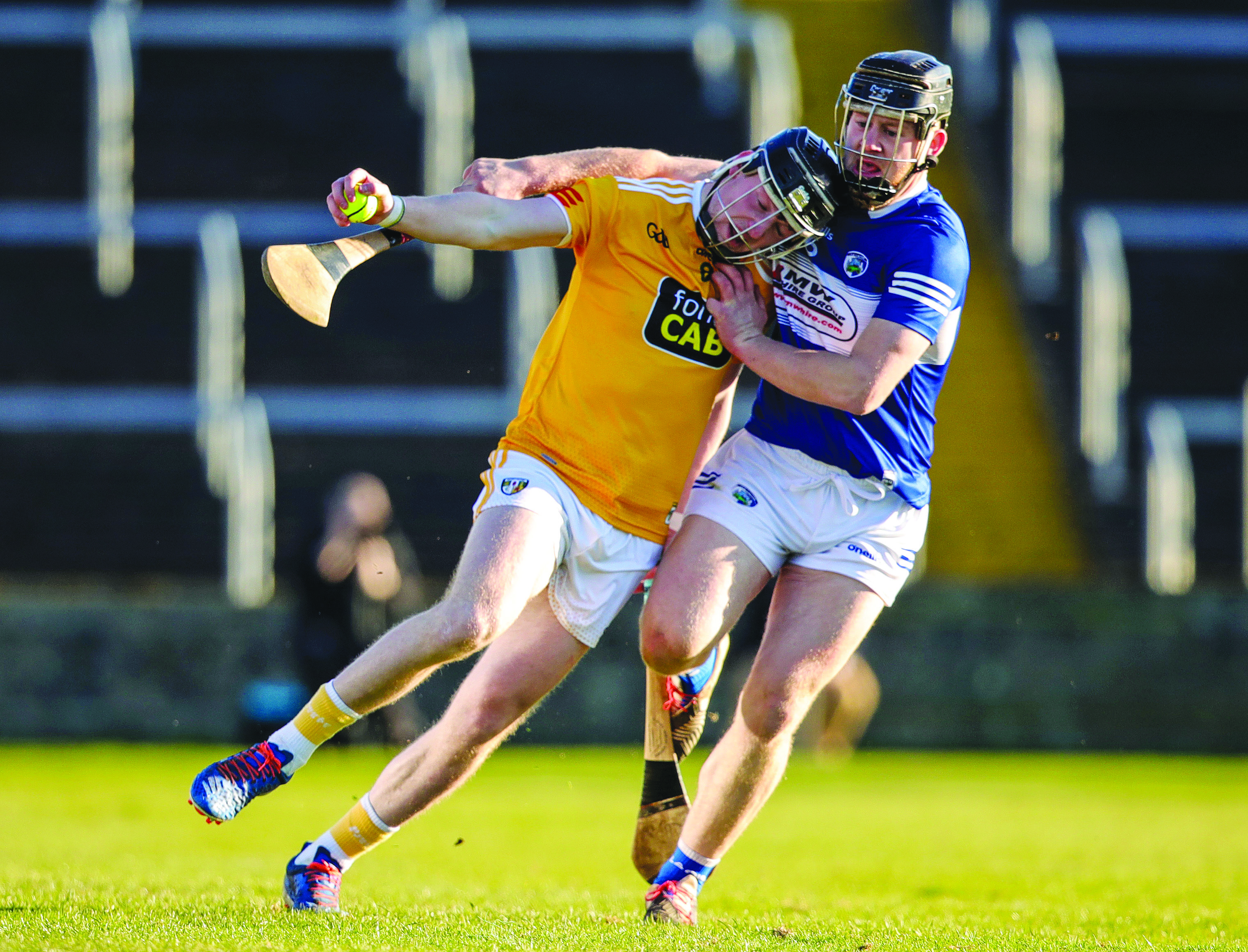 Keelan Molloy is bottled up by Liam O’Connell during last year’s meeting between the teams in O’Moore Park that was won by Laois, sending Antrim into a relegation payoff - a situation the Saffrons want to avoid this Sunday with the winner safe 
