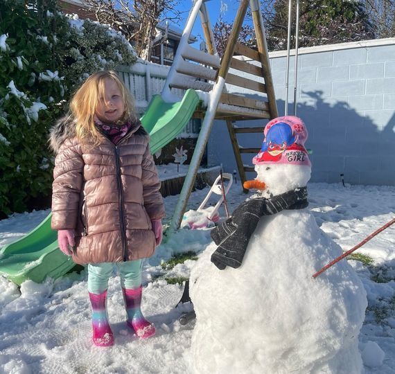 Fiath Martin (aged 4) building her new buddy in the snow 