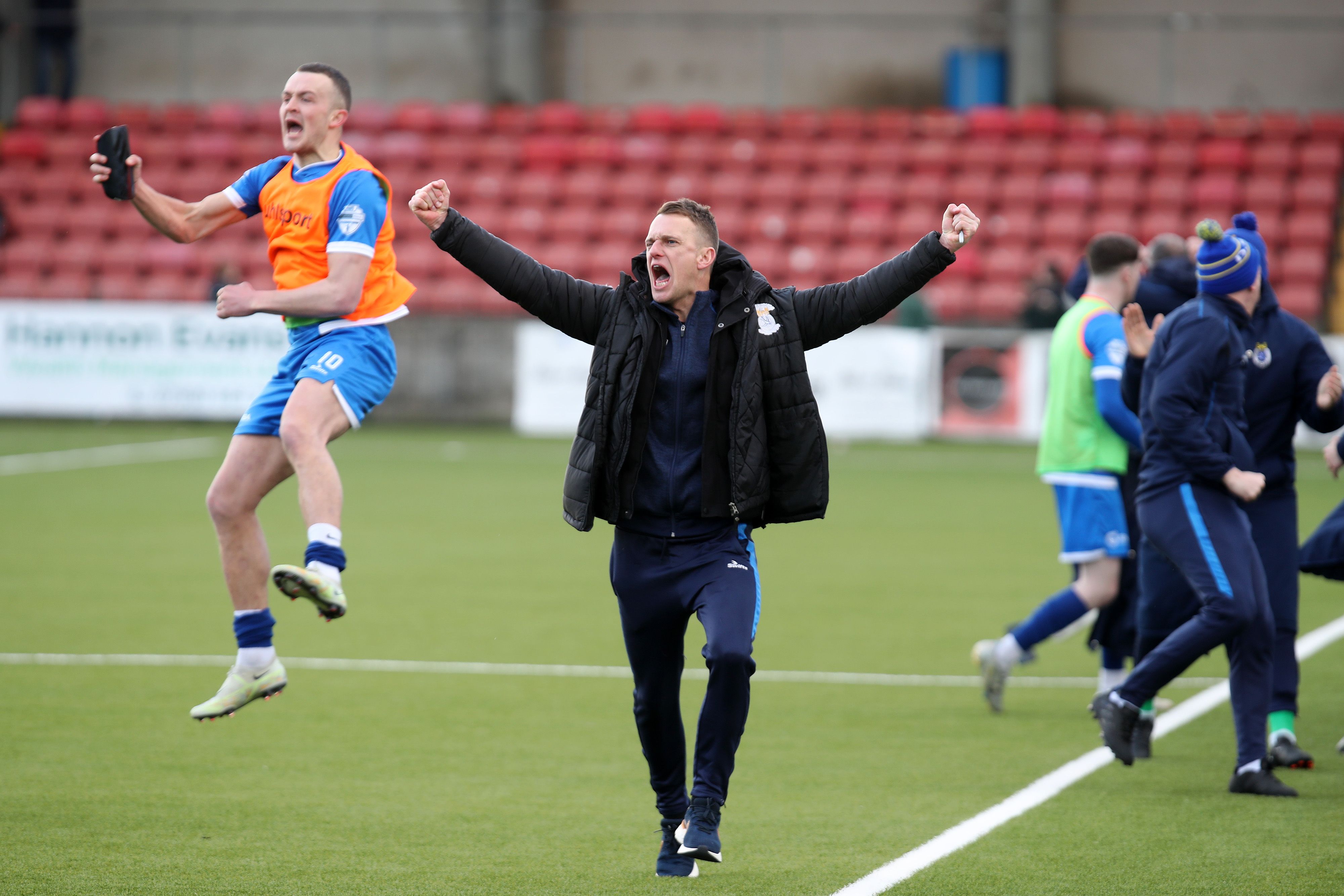 Dean Shiels celebrates as Joseph Moore scores in the dying seconds of the game to defeat Cliftonville 2-1