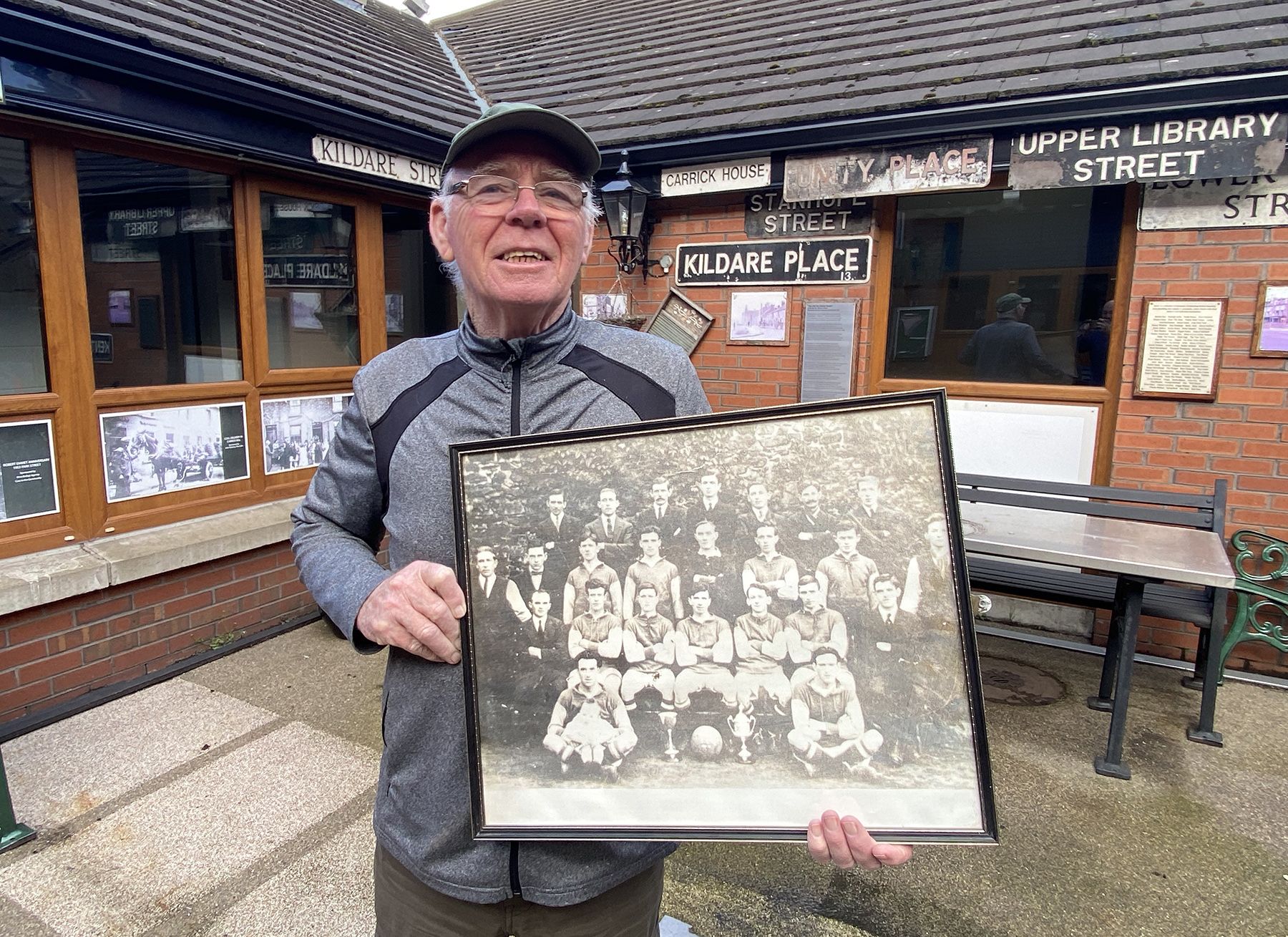 PROUD HISTORY: Frank Dempsey from Carrick Hill Residents\' Association with a picture of the Alton United team, winners of the FAI Cup in 1923
