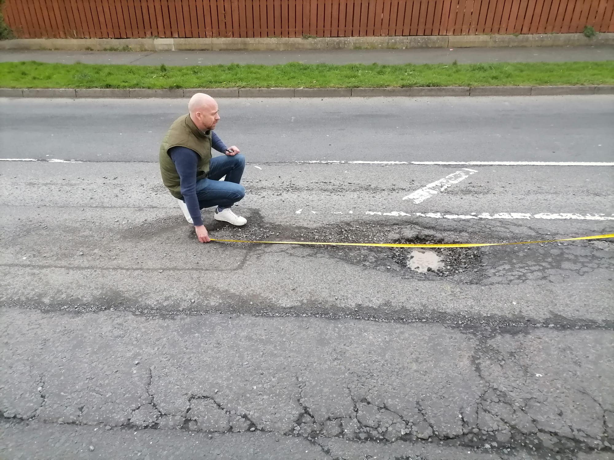 MEASURING UP: Cllr Joe Duffy demonstrating the extent of the problem