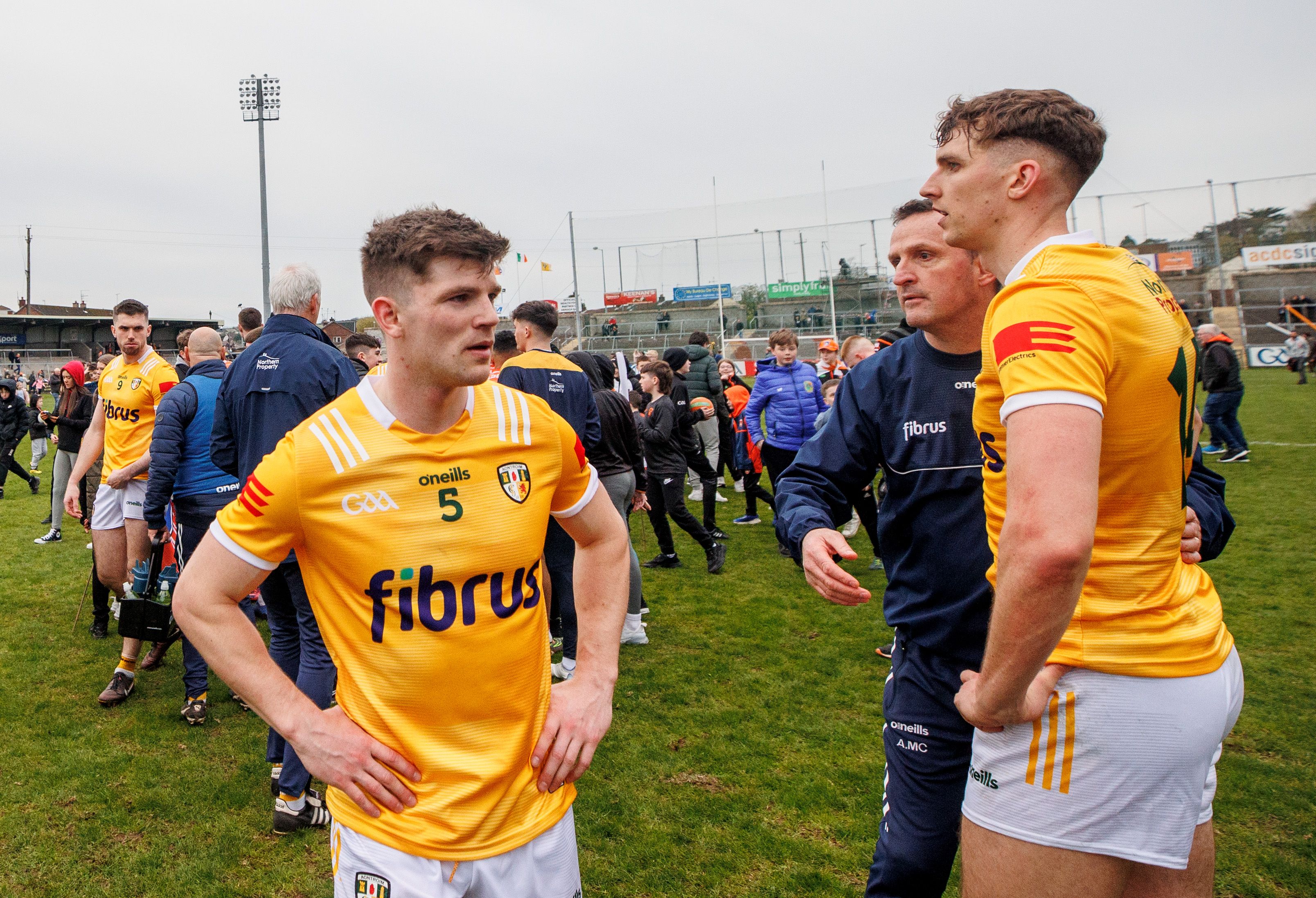Andy McEntee with Patrick McCormack, Ruairi McCann (Aghagallon) after Saturday\'s loss at the Athletic Grounds 