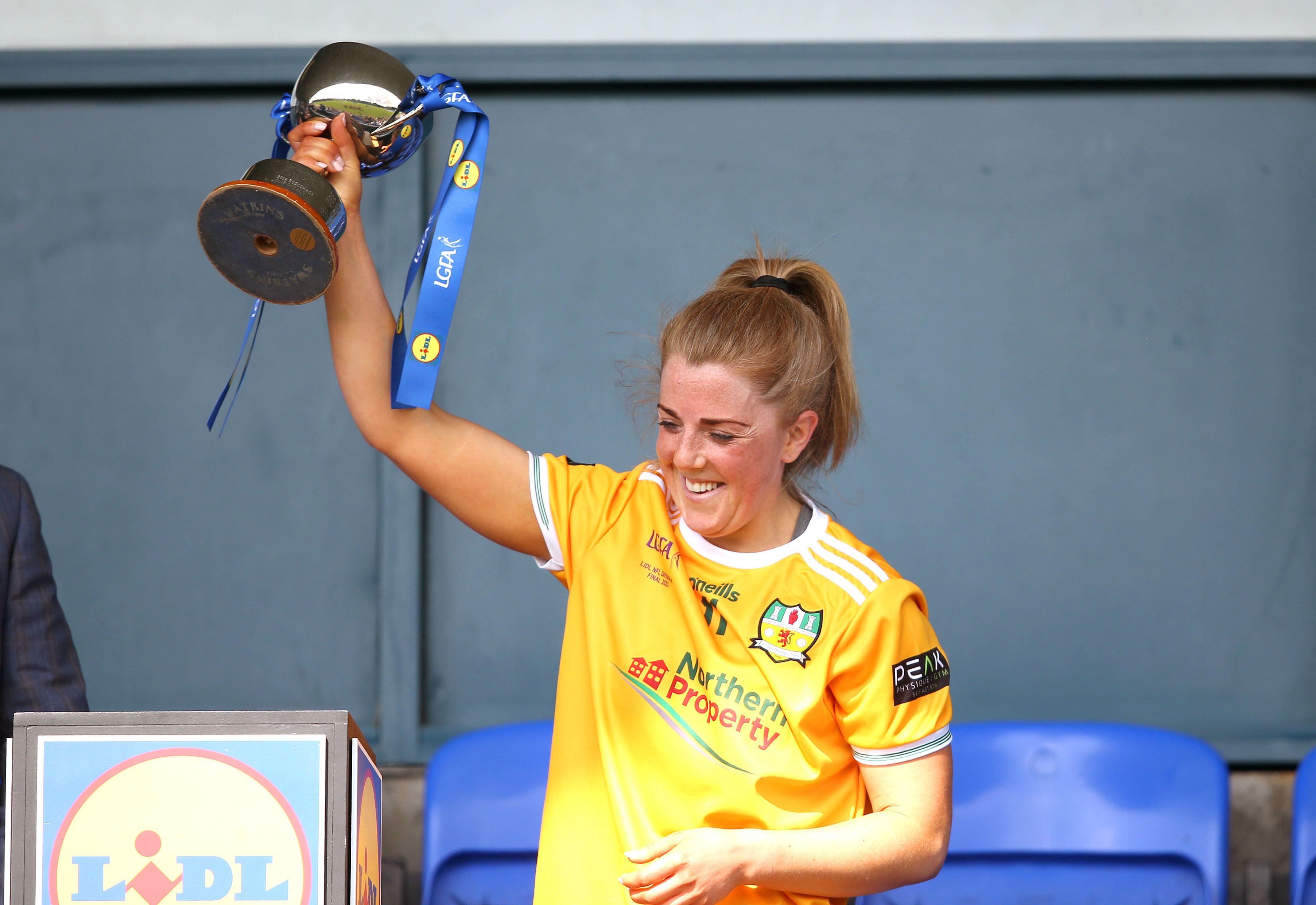 Antrim captain, Cathy Carey, lifts the Division Four trophy 