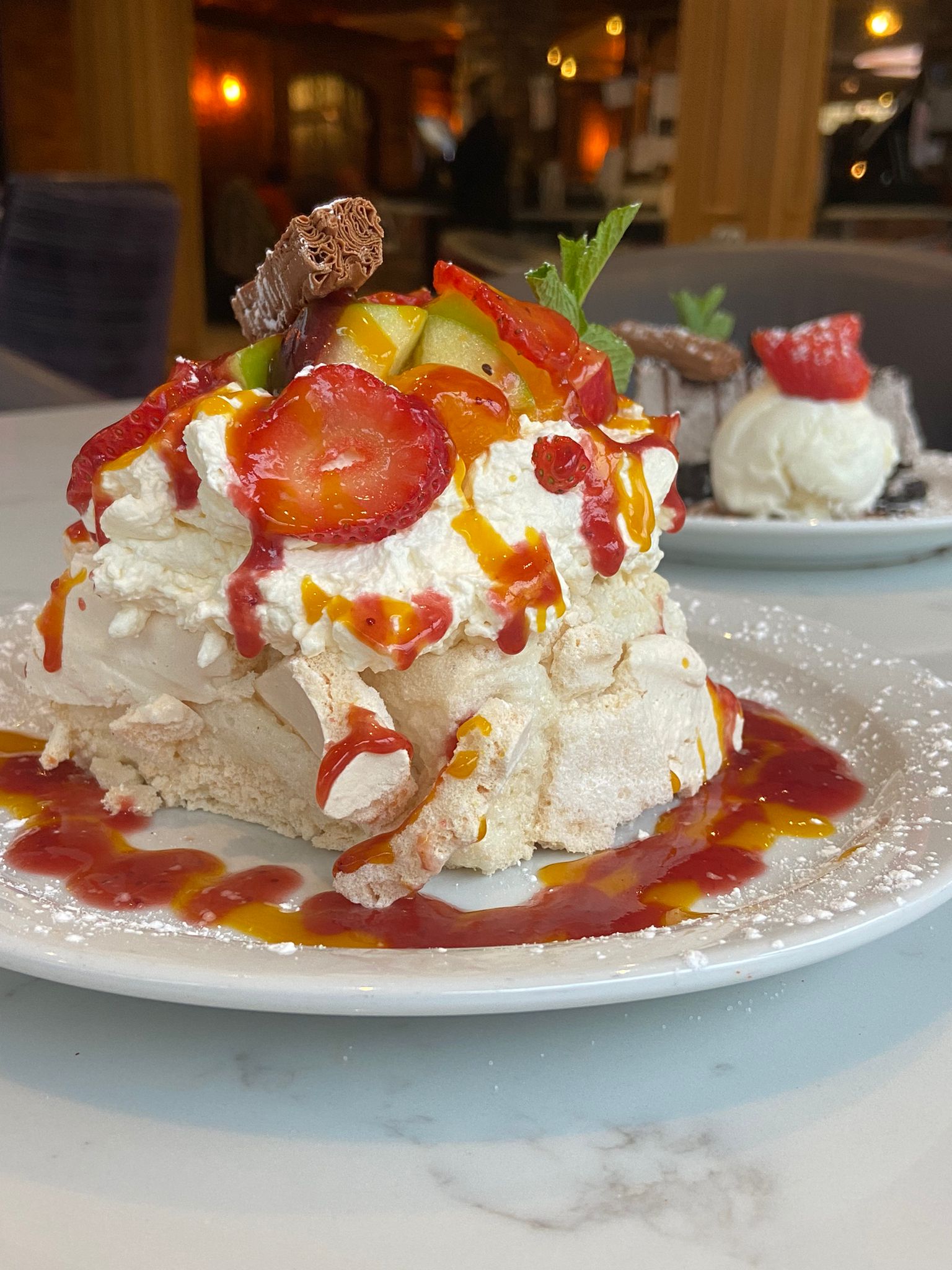 Fresh Fruit Pavlova, served with fresh cream