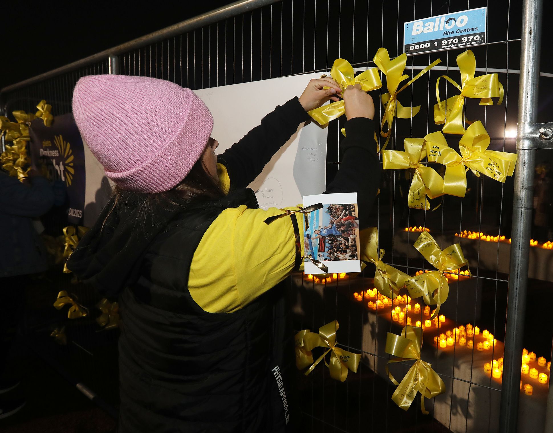 REMEMBRANCE: People pin messages to loved ones on the Wall of Hope
