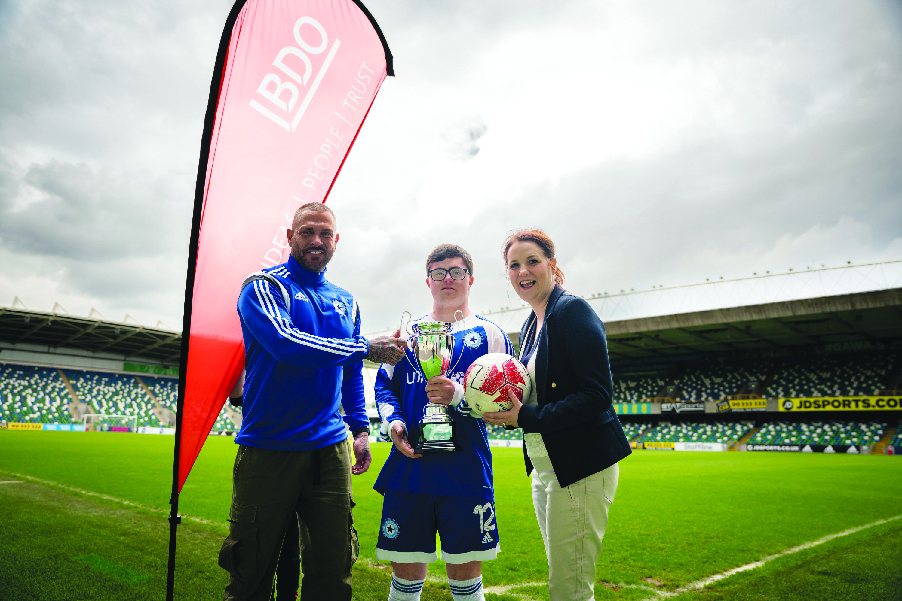 Pictured at the launch of the BDO NI Special Schools FA Cup in partnerhsip with the Irish FA, Steven Burnett, PE Teacher at Tor Bank School, Dundonald with pupil Daniel McKee and Laura Jackson, Partner at BDO NI