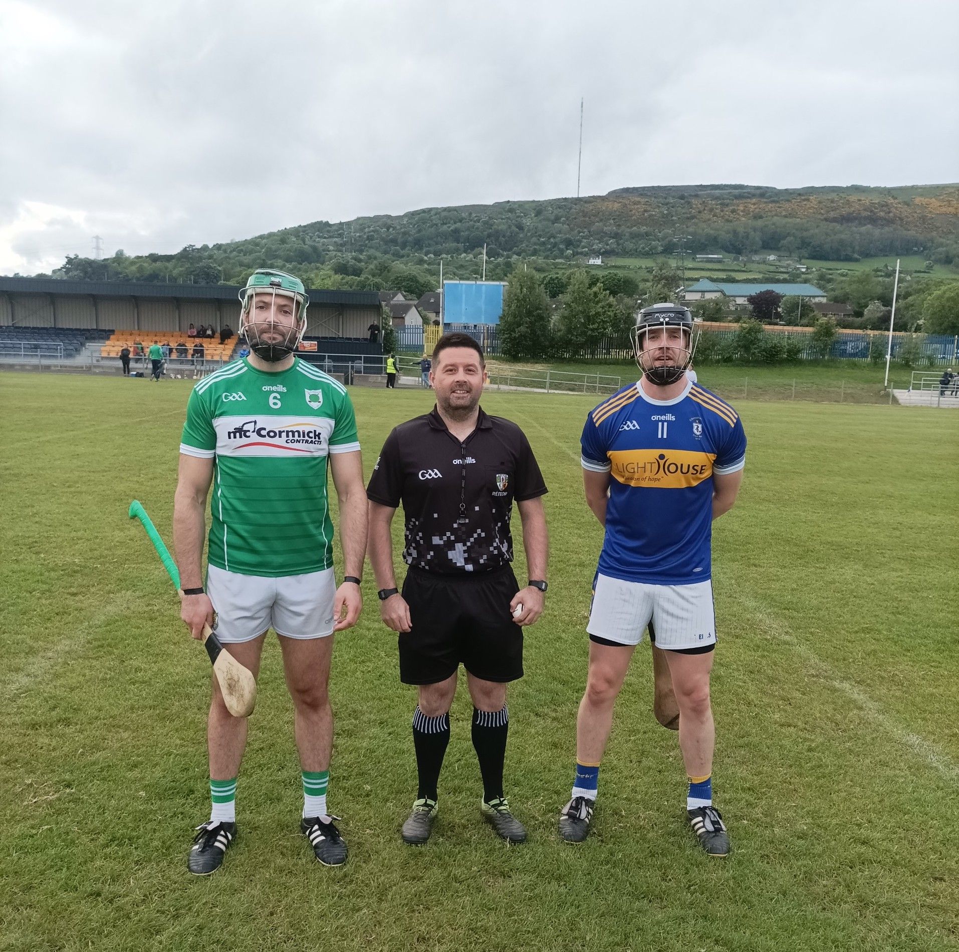 Tam captains James McCouaig (Carey) and Stephen Beatty (Rossa) with referee Kevin Parke 