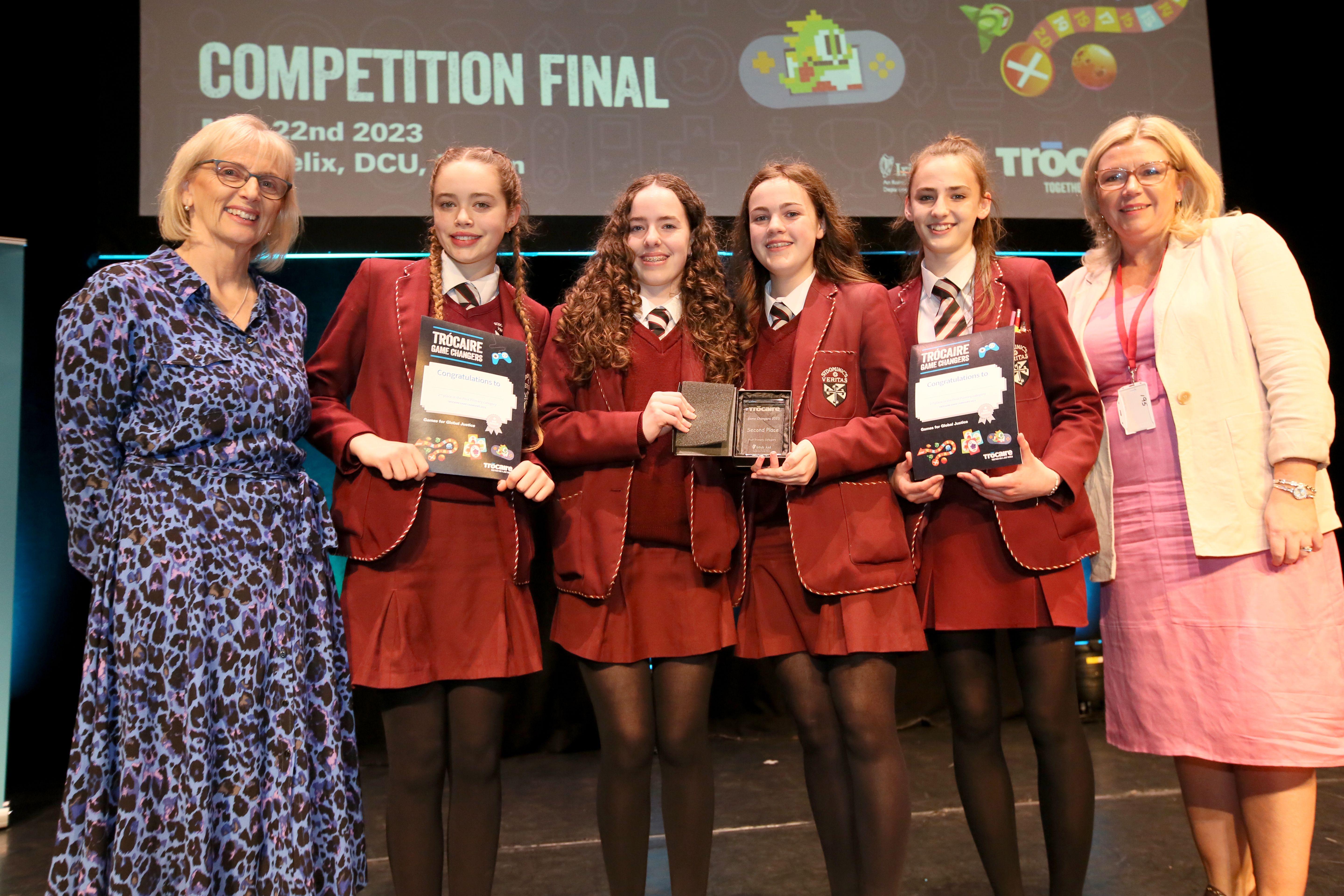 WELL DONE: St Dominic’s Grammar pupils, with Trócaire’s Finola Finnan, left, who won second place with their game ‘Hedbanz Global Goals’
