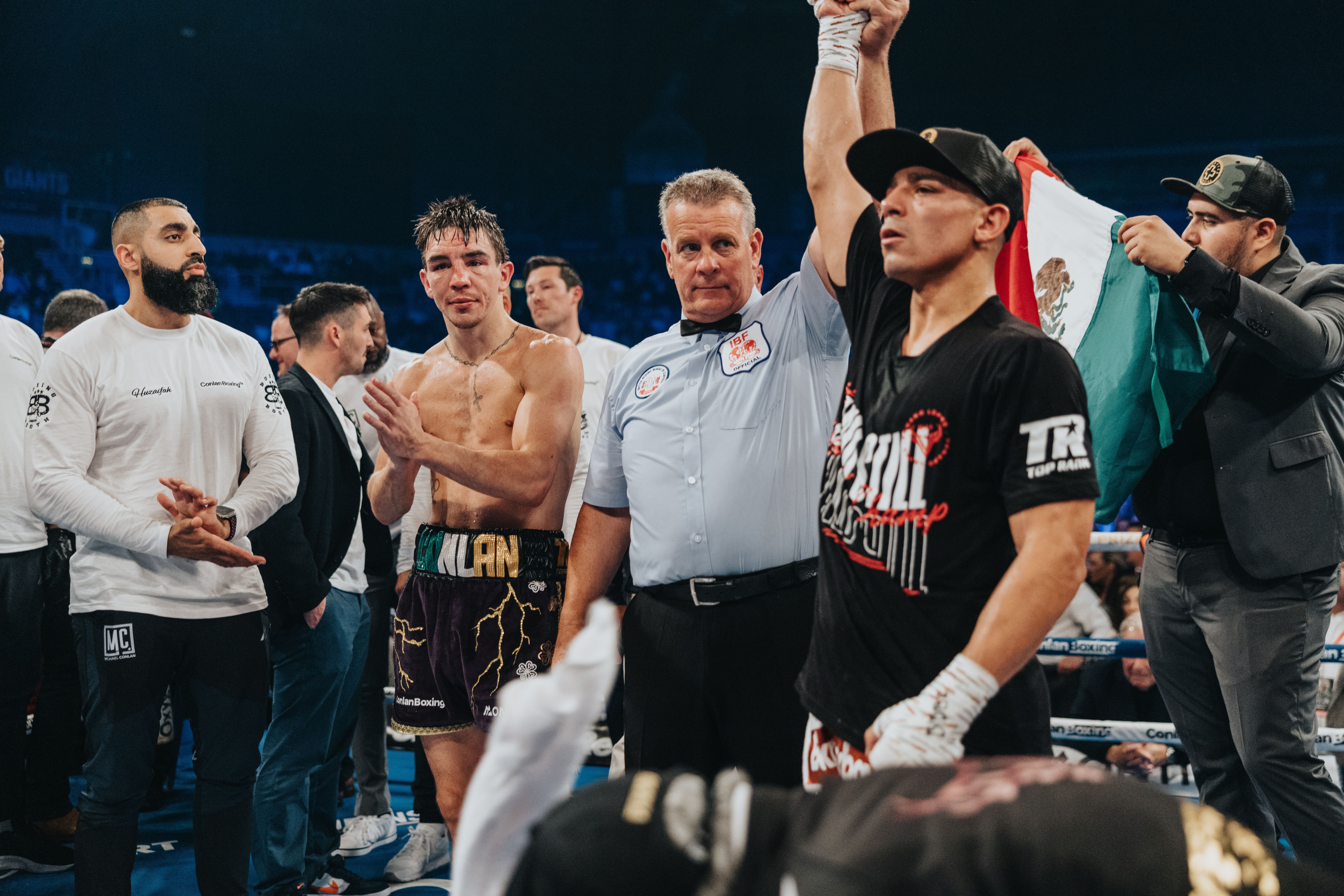 Luis Alberto Lopez has his hand raised as a dejected Michael Conlan looks on at the SSE Arena on Saturday 