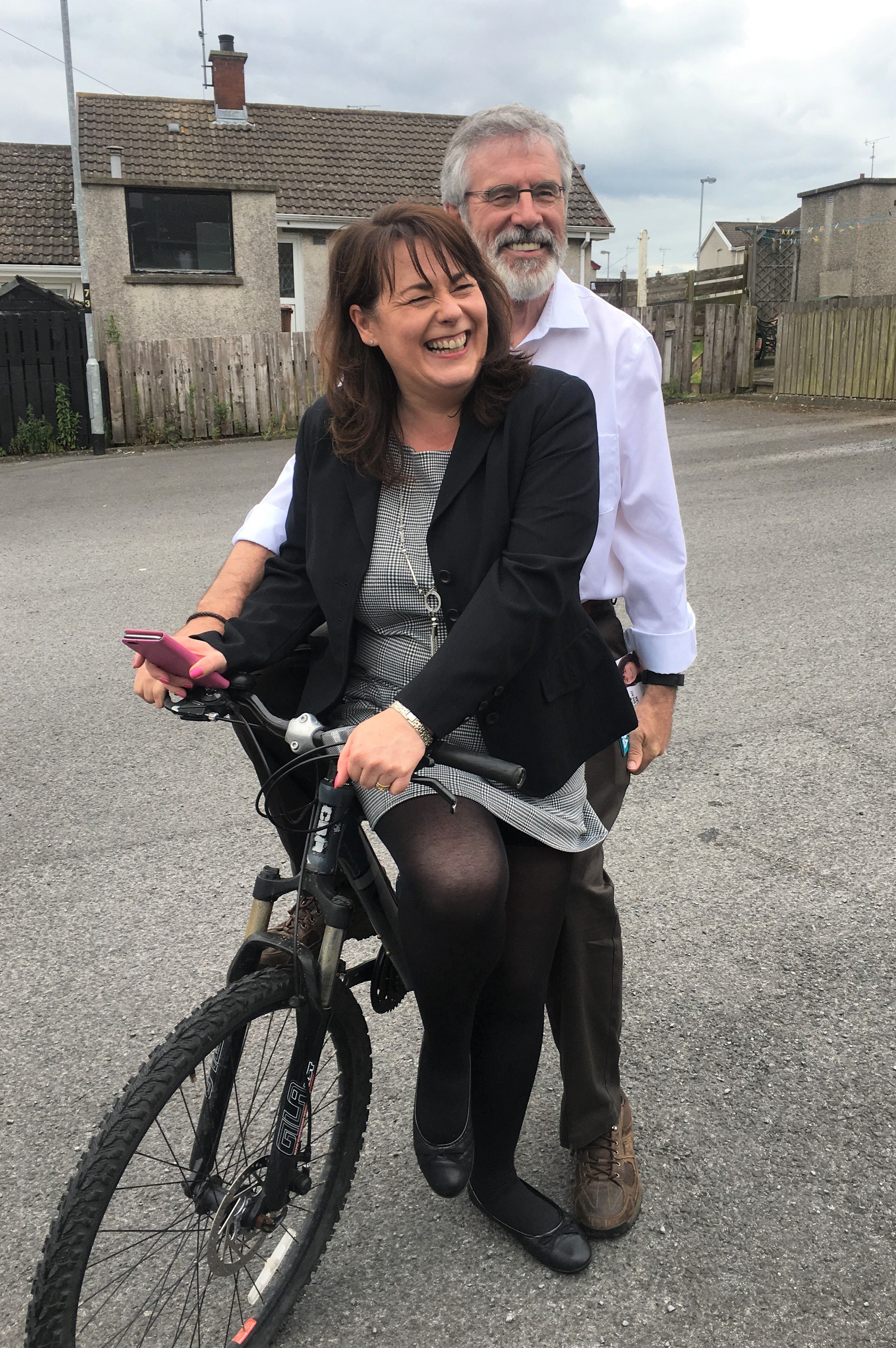 SADDLE-SORE: Gerry Adams on his trusty bike with party colleague Michelle Gildernew