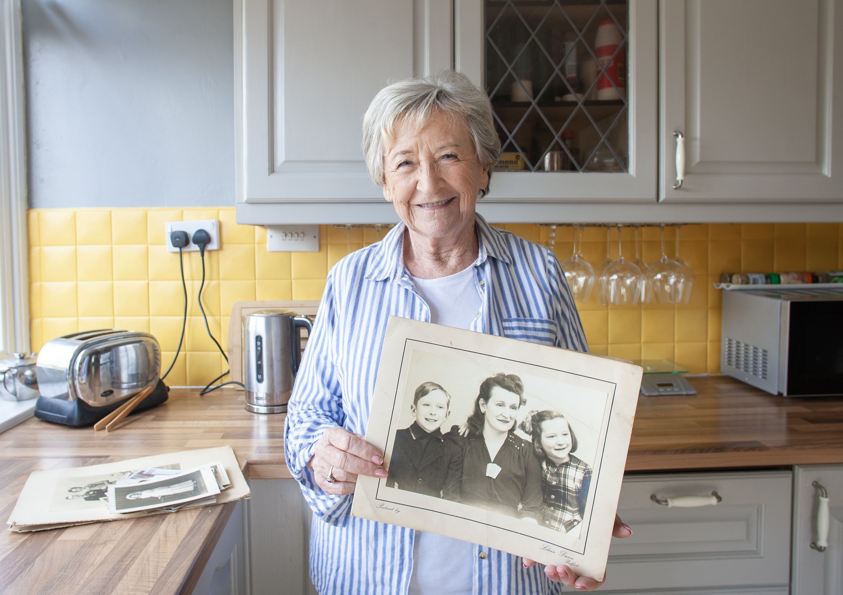 REUNITED: Jean Morris, née Buckle, was reunited with the photos which lay in a Lenadoon loft for 47 years