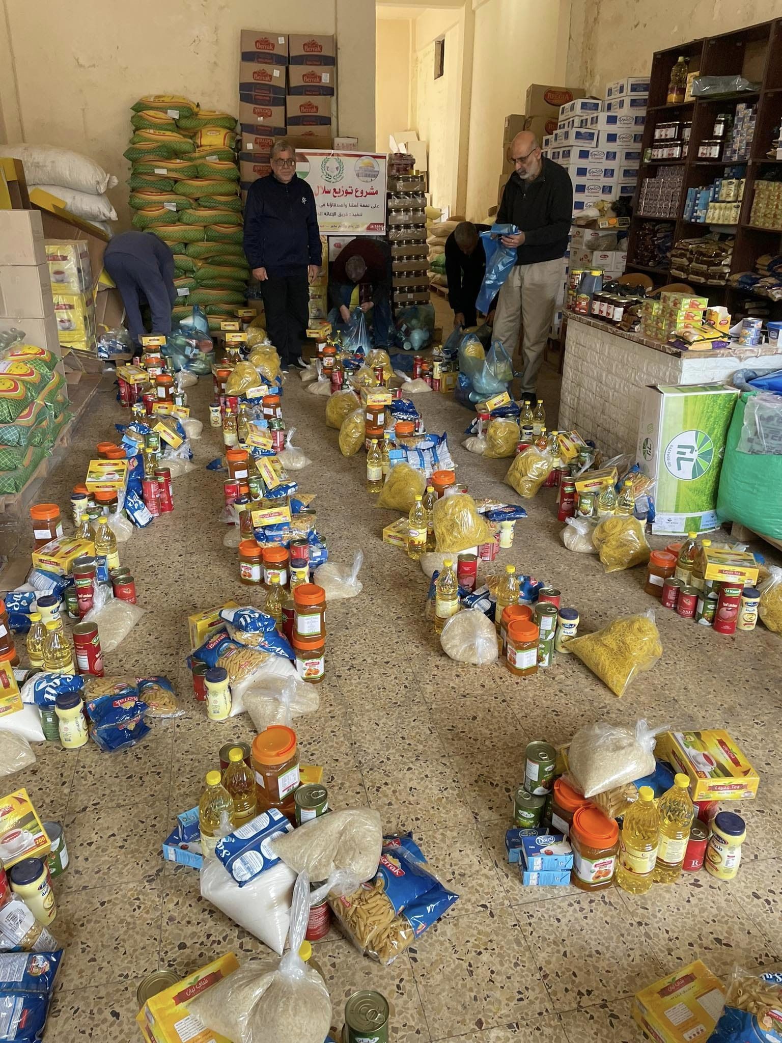 WORKING HARD: Volunteers for Palestine Aid in Gaza with some of the food parcels which were raised by the charity