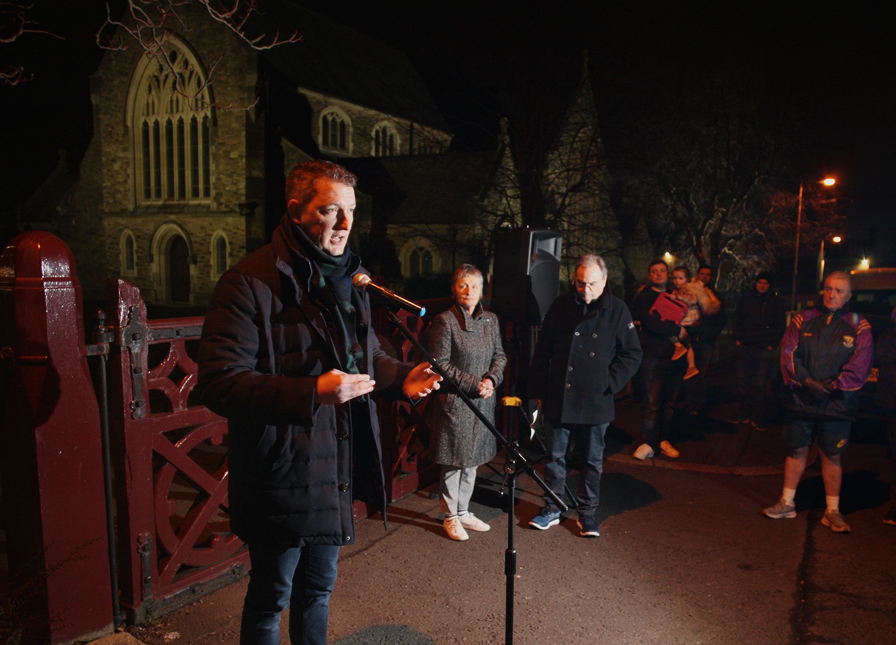\'ON THE GOOD GUYS SIDE\': John Finucane MP addressing a vigil for his murdered father in February of this year.