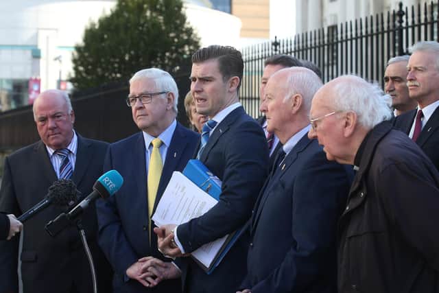 APOLOGY: Darragh Mackin, of Phoenix Law with some of the Hooded Men 