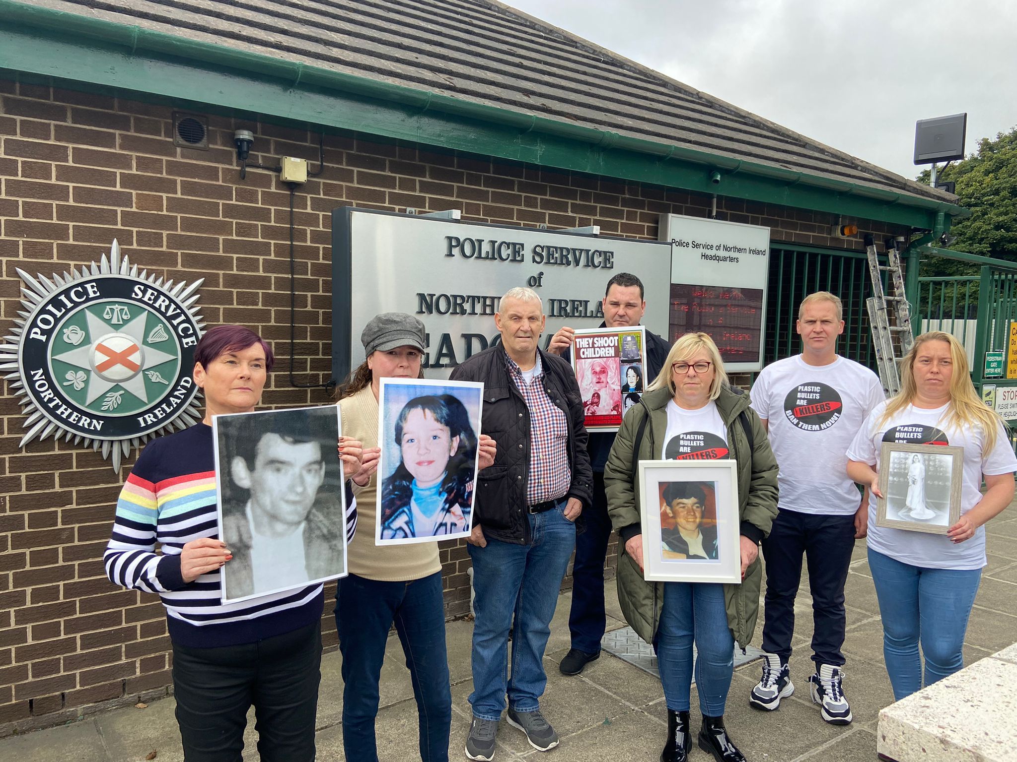 LEGACY: Christine Duffy (third from right) holding a picture of Seamus Duffy with other members of United Campaign Against Plastic Bullets