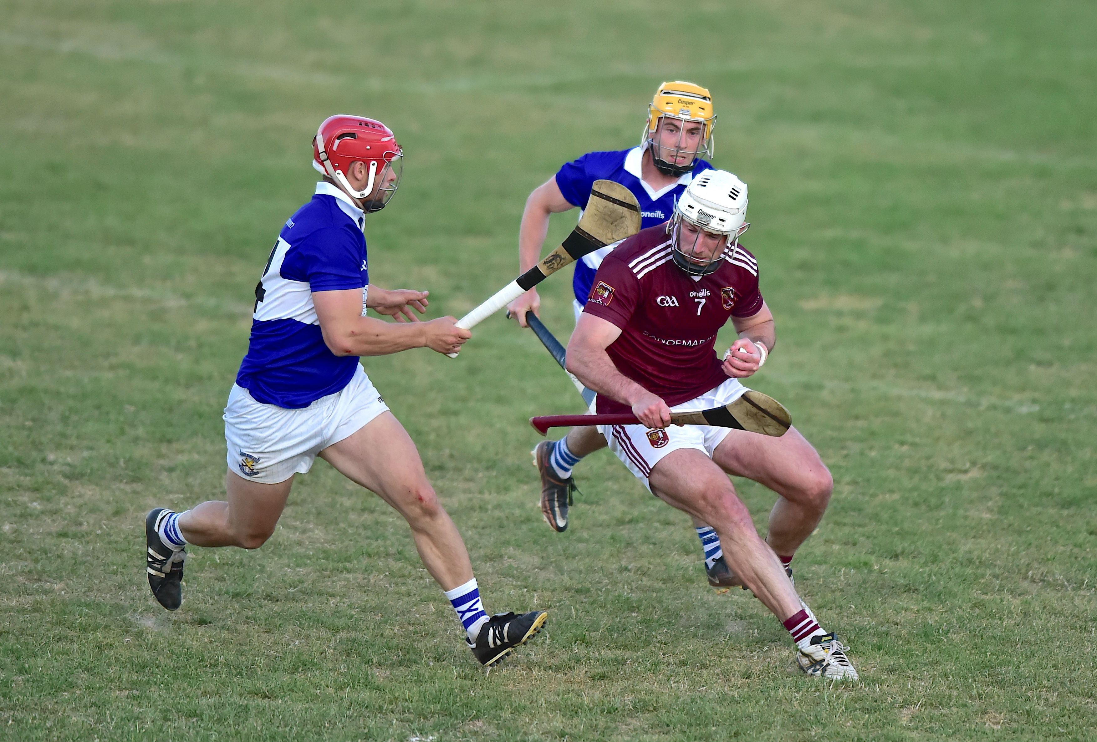 Conor Johnston and Ruairi Galbraith close in on Paddy Burke at Corrigan Park on Wednesday 