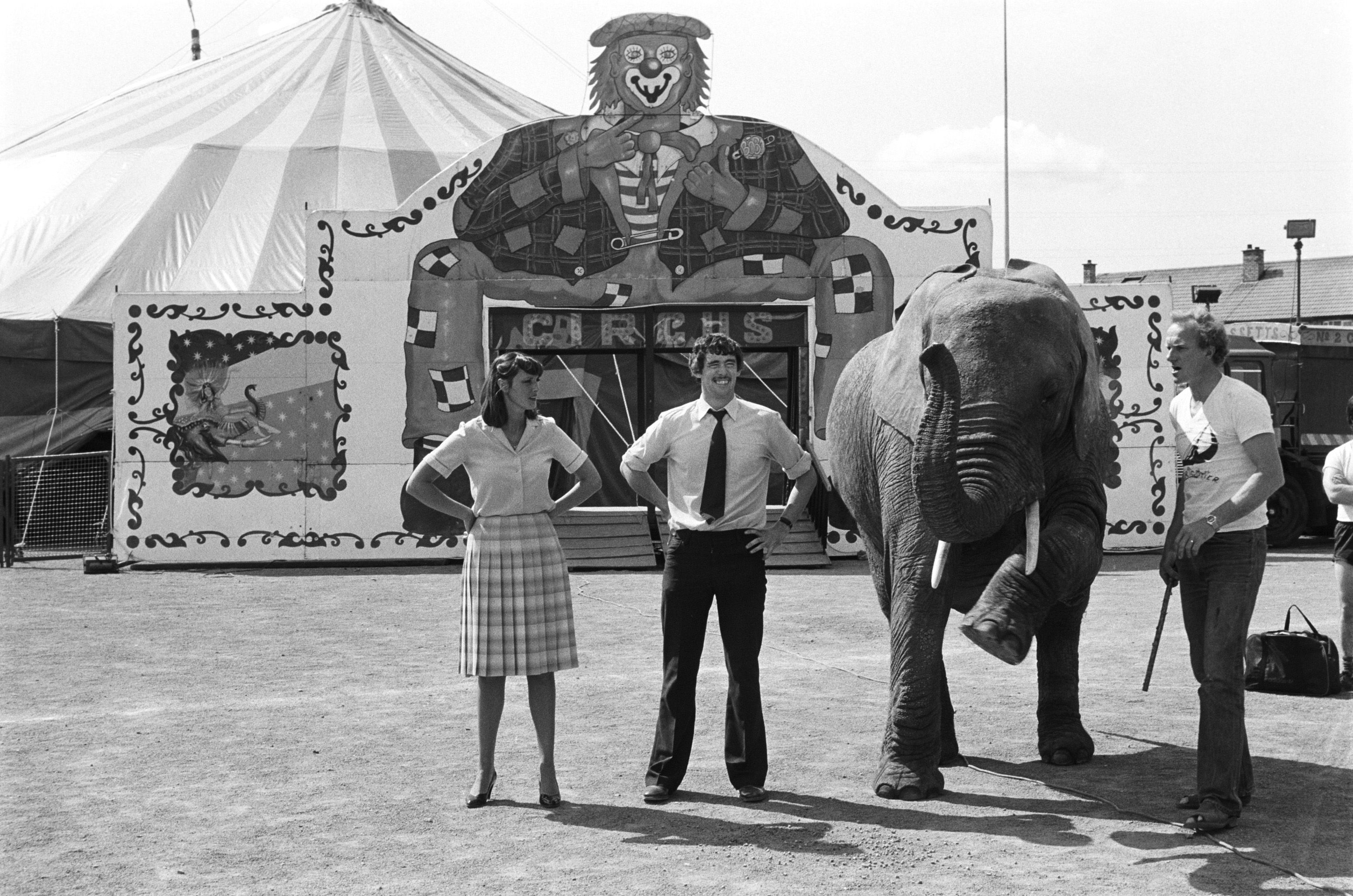 ROLL UP, ROLL UP: Andersonstown Leisure Centre manager Kevin McGlinchey, centre, welcomes Fossett\'s Circus and Sonia the Elephant to the Andersonstown venue