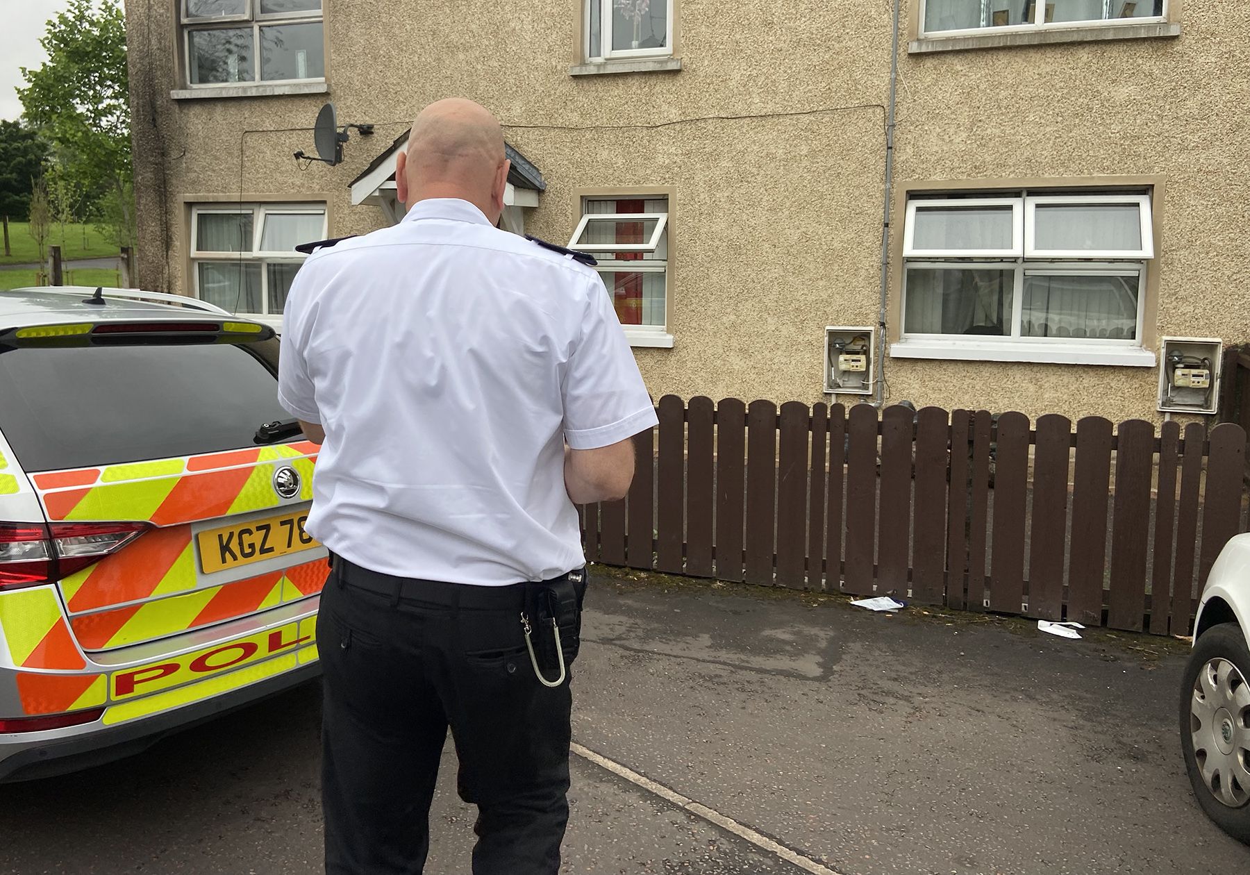 TRAGEDY: Police at the scene of the fire at a flat in Gardenmore Road on Tuesday morning