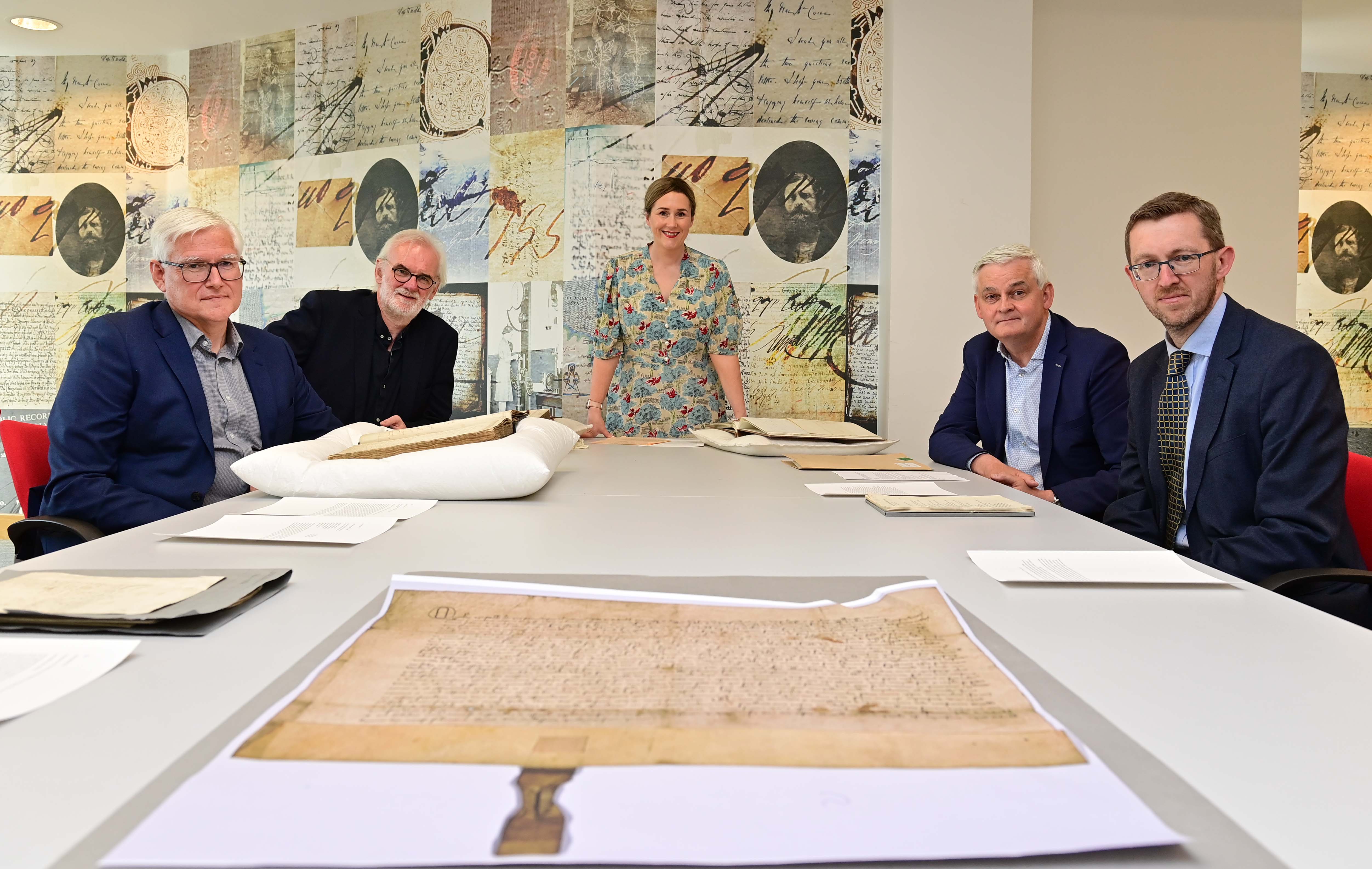 HISTORICAL: DFC\'s Permanent Secretary Colum Boyle, comedian Tim McGarry, DfC Deputy Secretary Moira Doherty, PRONI Acting Director David Huddleston and former BBC journalist Stephen Walker surveying just some of the 100 documents