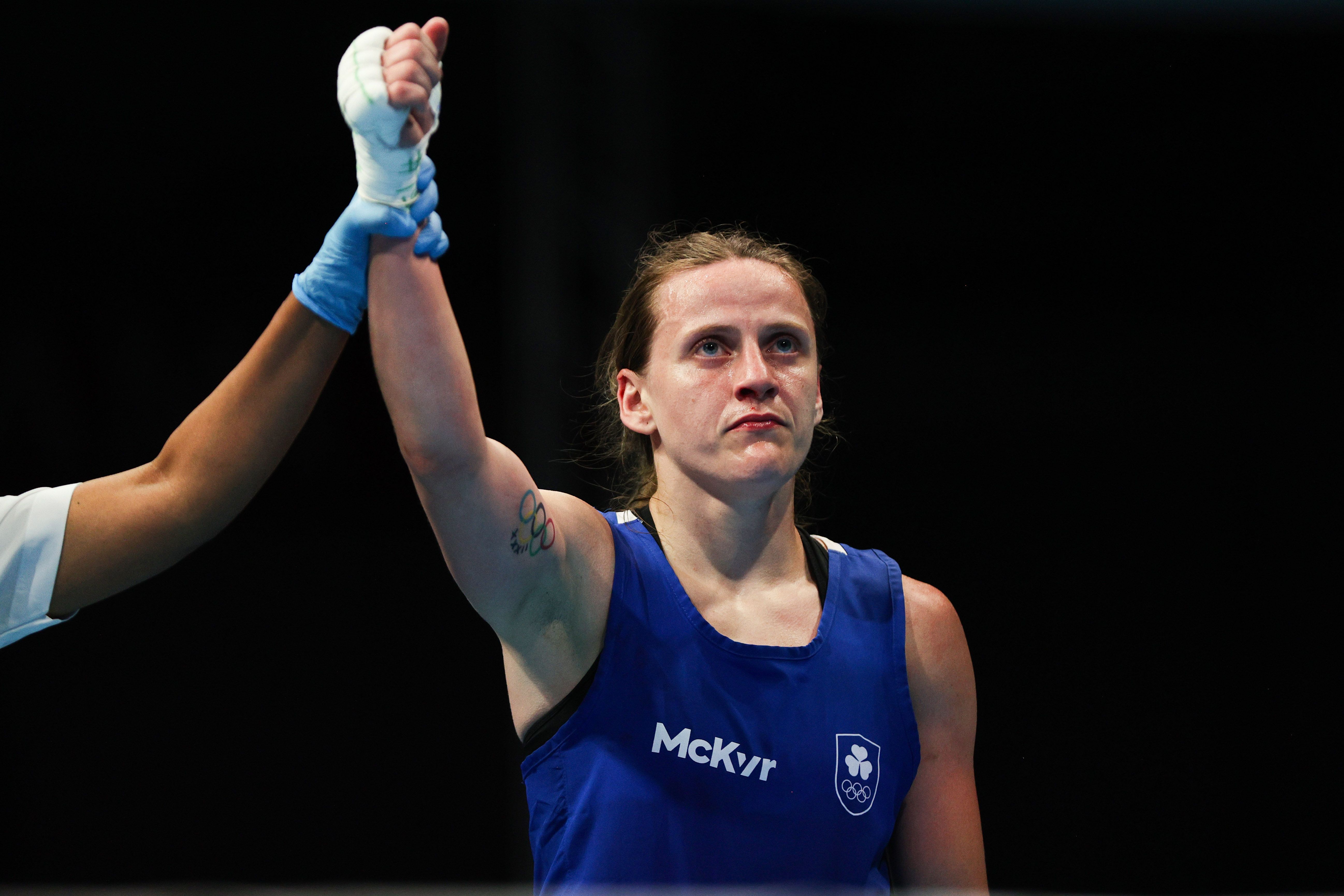 Michaela Walsh has her hand raised following Tuesday\'s victory over Aysen Taskin in their 57kg last 16 bout at the European Games