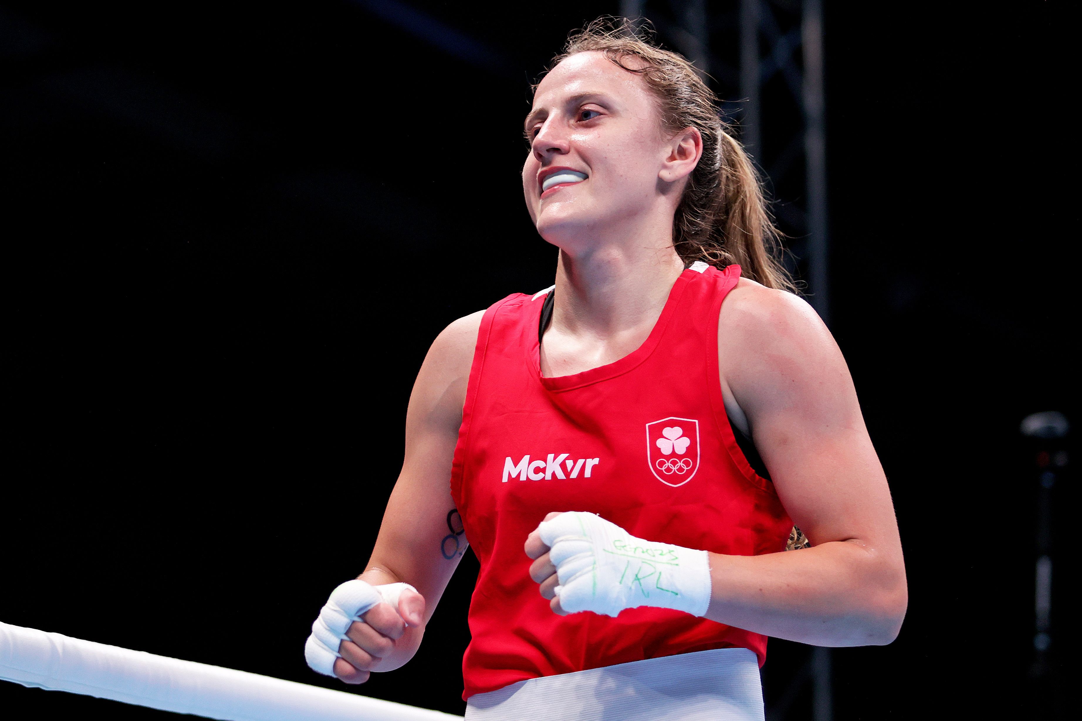 Michaela Walsh celebrates her featherweight quarter-final win over Melissa Juvonen Mortensen at the European Games that guarantees a medal and a spot at next year\'s Olympics in Paris 