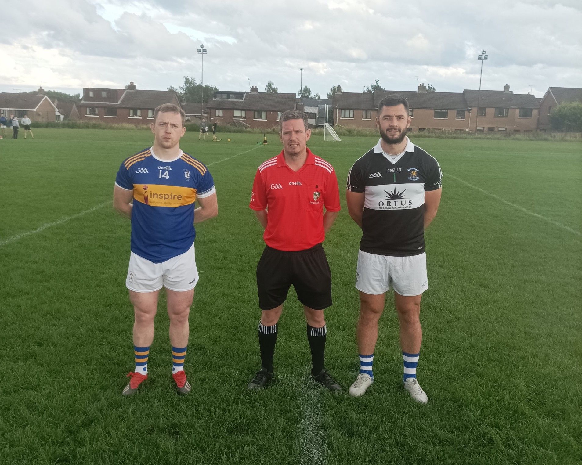 Team captains Thomas Morgan (Rossa) and Padraig Nugent (St John\'s) with referee Cathal McDermott before the game 