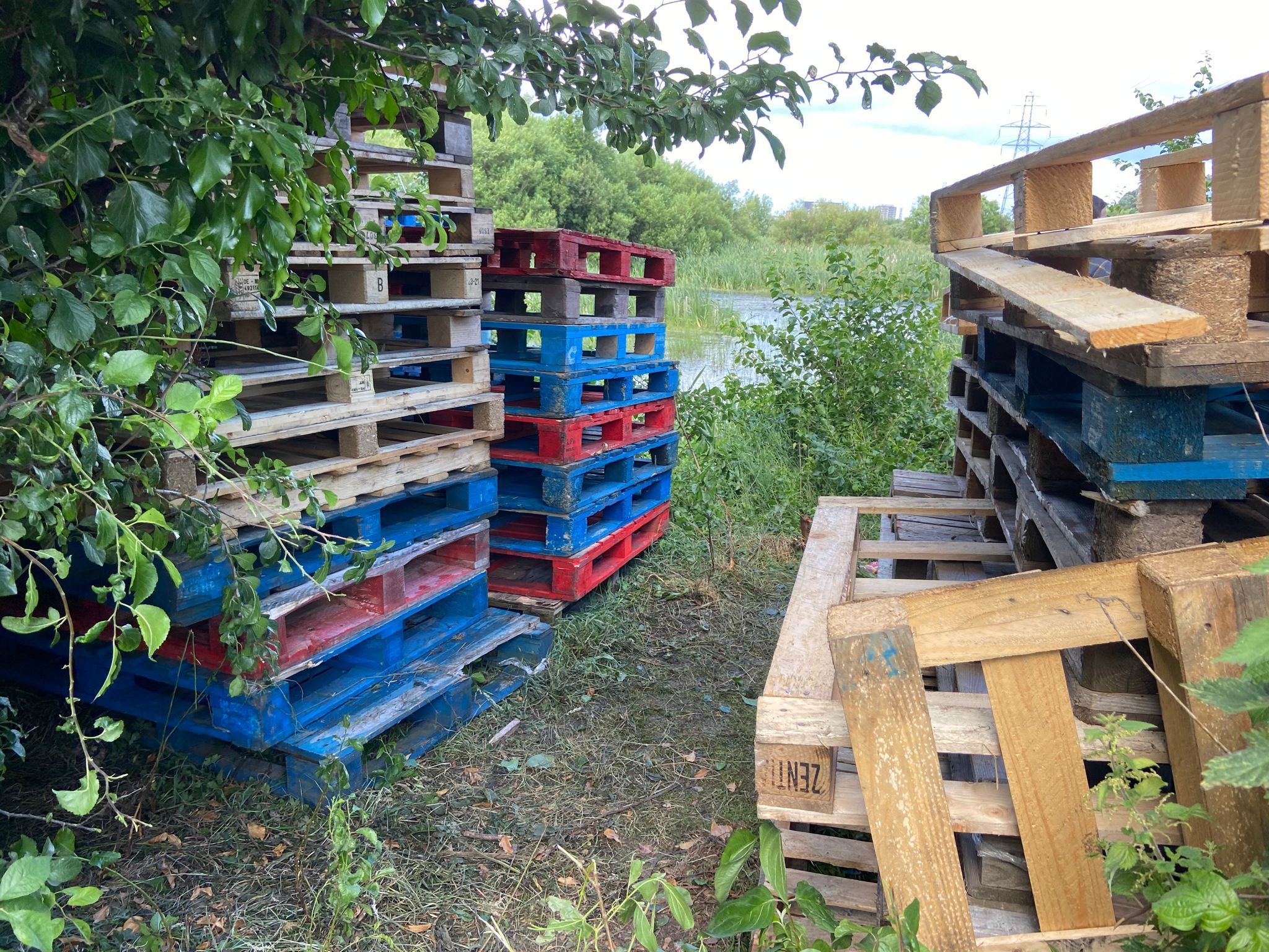 CONCERN: Pallets were stacked up around the birdwatching hut including at the back facing the pond