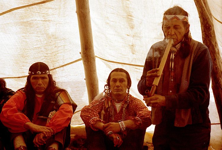 HISTORY MAKERS: American Indian Movement leaders Dennis Banks (left) and Russell Means, seated, with Lakota medicine man Wallace Black Elk at Wounded Knee in 1973