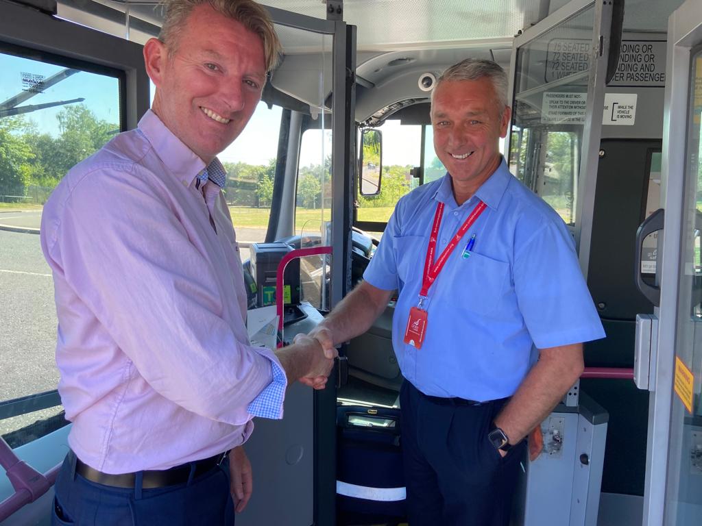 CONGRATULATIONS: Damian Bannon, Translink\'s Belfast Area Manager, congratulates driver Sam Erskine on his award