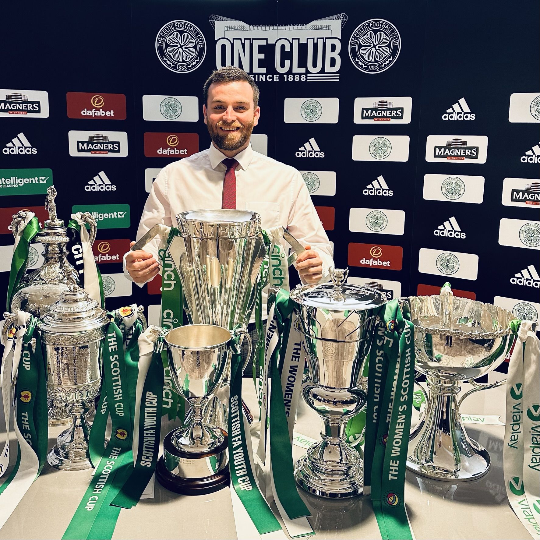 SILVERWARE: Josh with the club\'s recent trophy haul  including the men\'s treble, Women\'s Cup, The Glasgow Cup and the Scottish Youth Cup