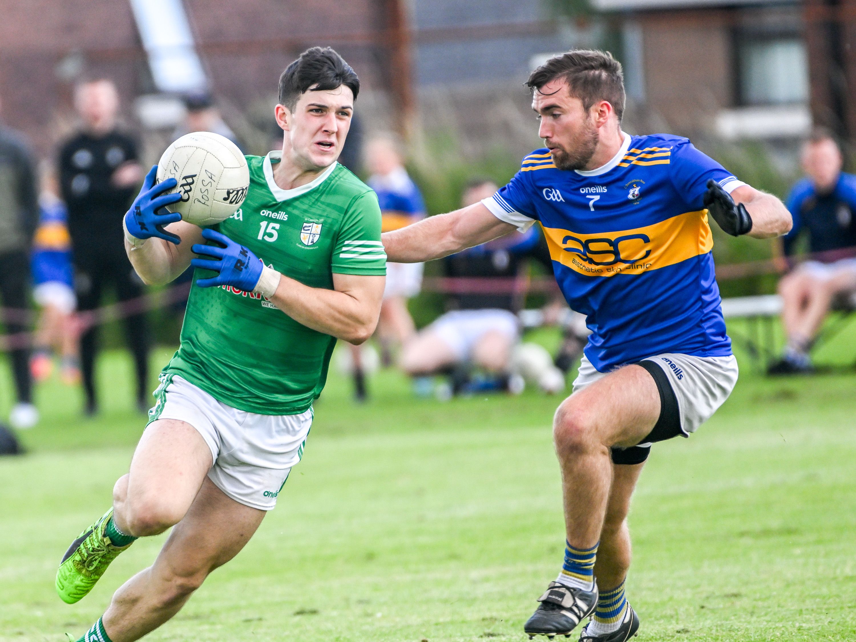 Conhuir Johnston is tracked by Richard Gowdy during Cargin\'s win over Rossa on Saturday