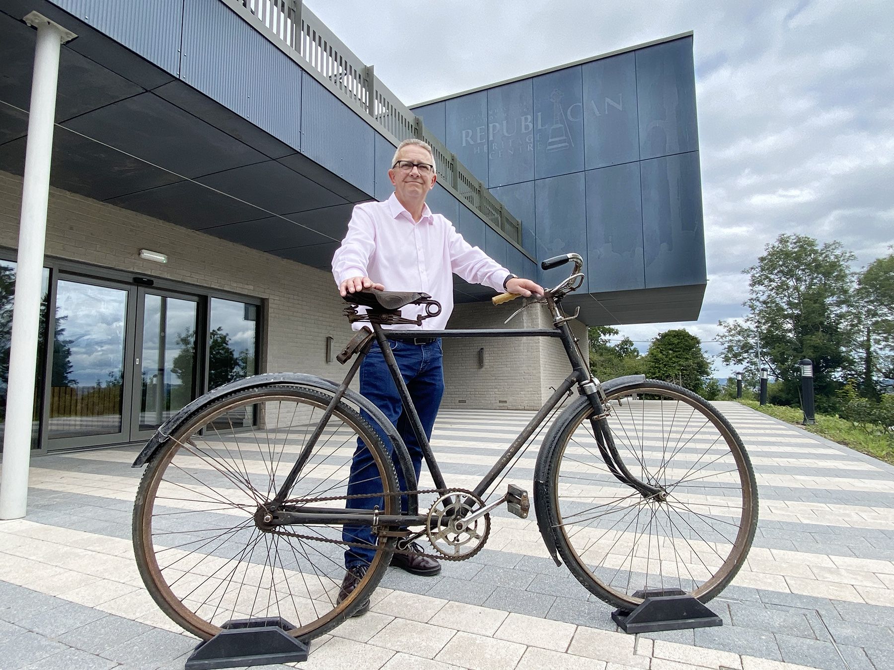 ACTIVE SERVICE: Director of the Roddy McCorley Heritage Centre Davy McGivern pictured with Paddy Rankin’s IRA bicycle