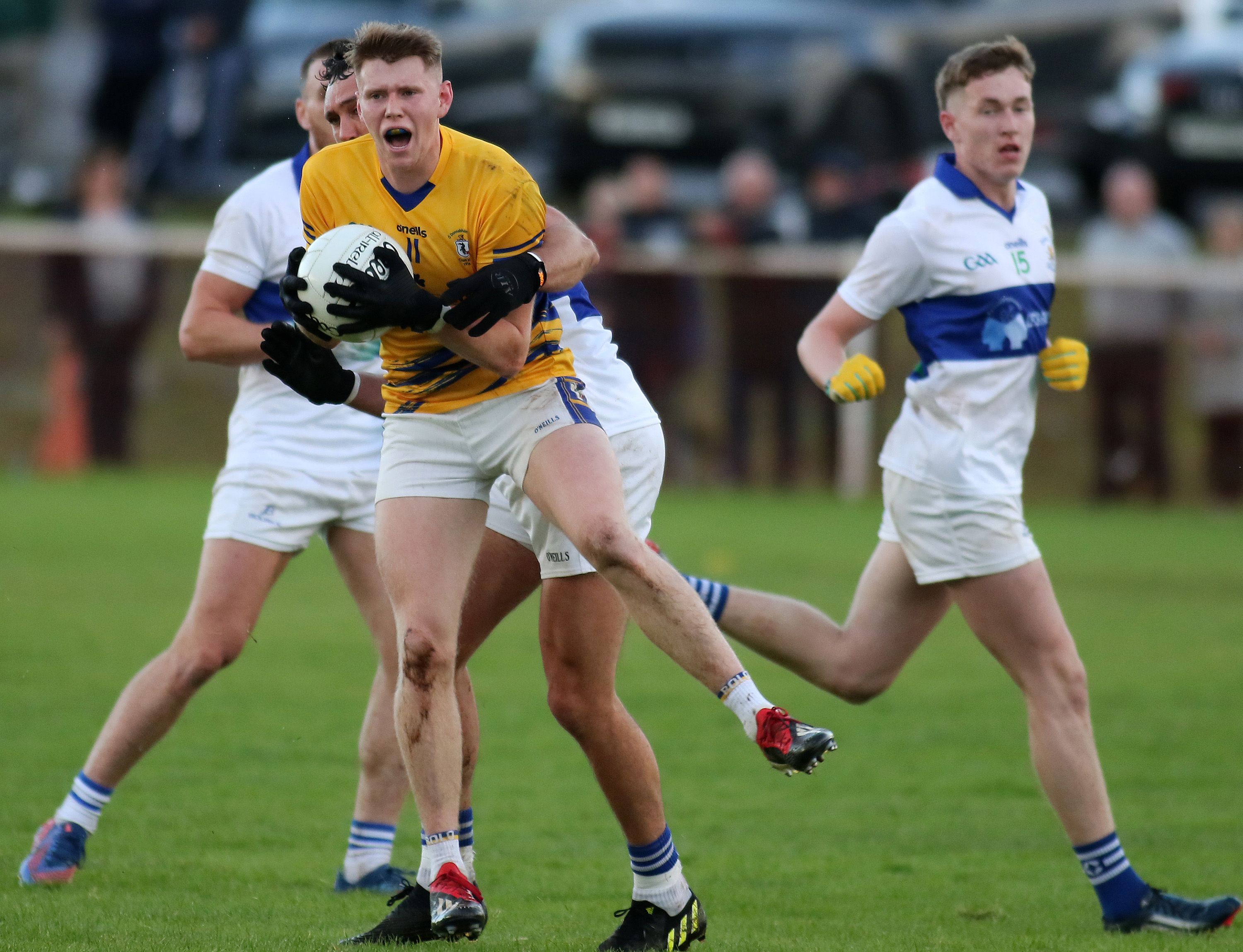 Cormac McGettigan is challenged during Rossa\'s win on Saturday
