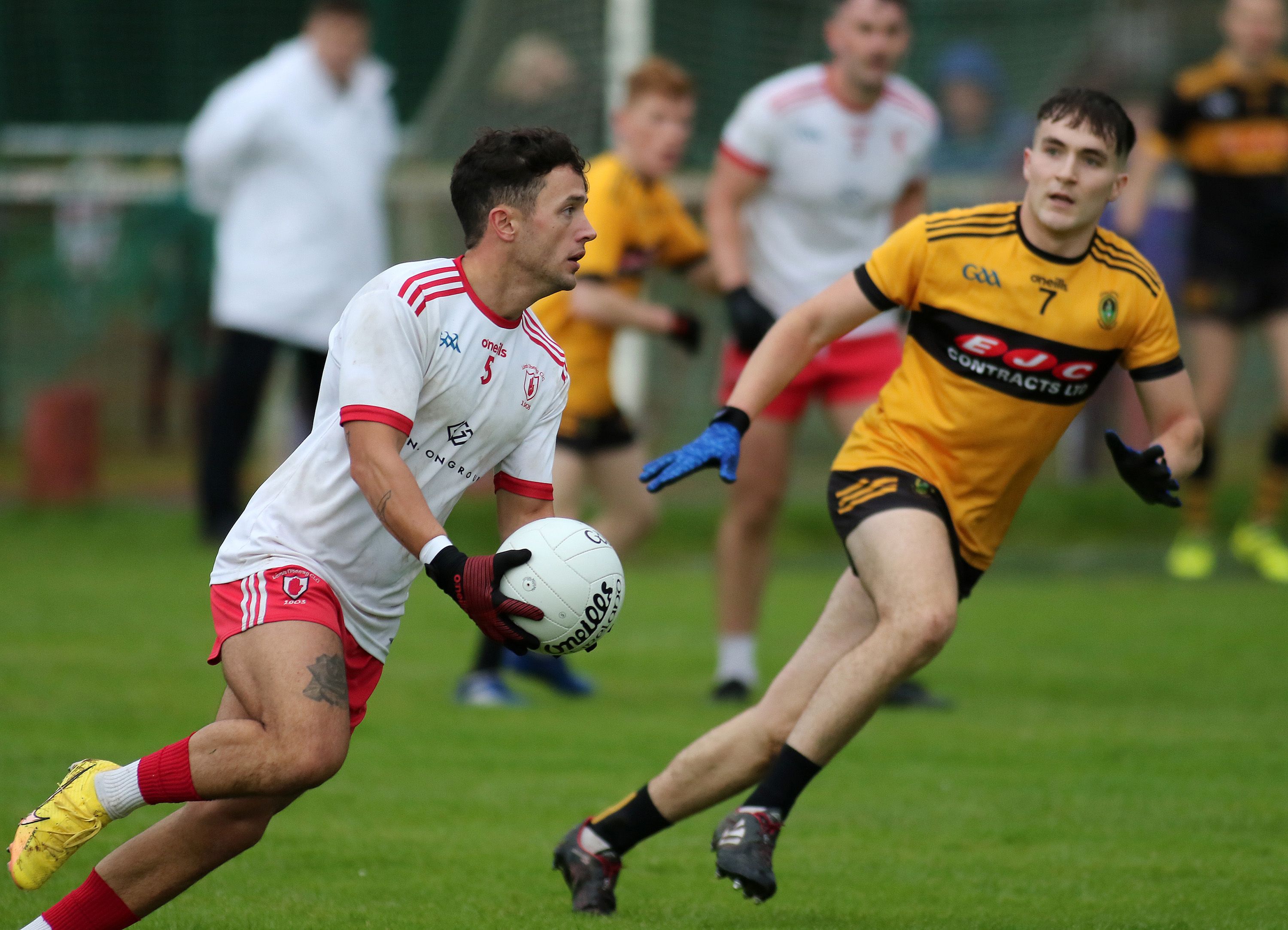Eoin McKeown bursts past Ronan O\'Neill at Hannahstown on Saturday 