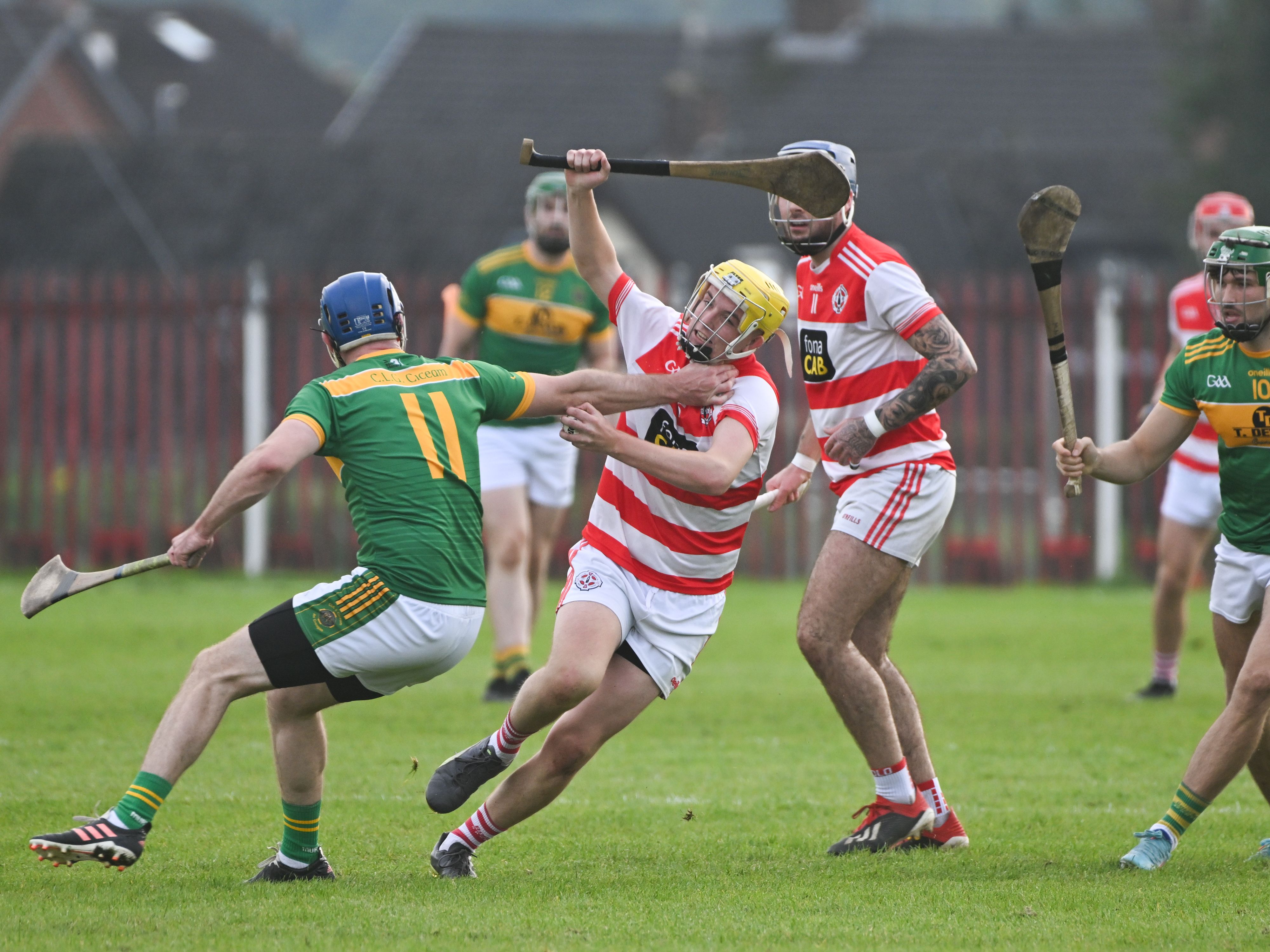 Thomas Duff is challenged by Creggan\'s Niall McAuley on Saturday 