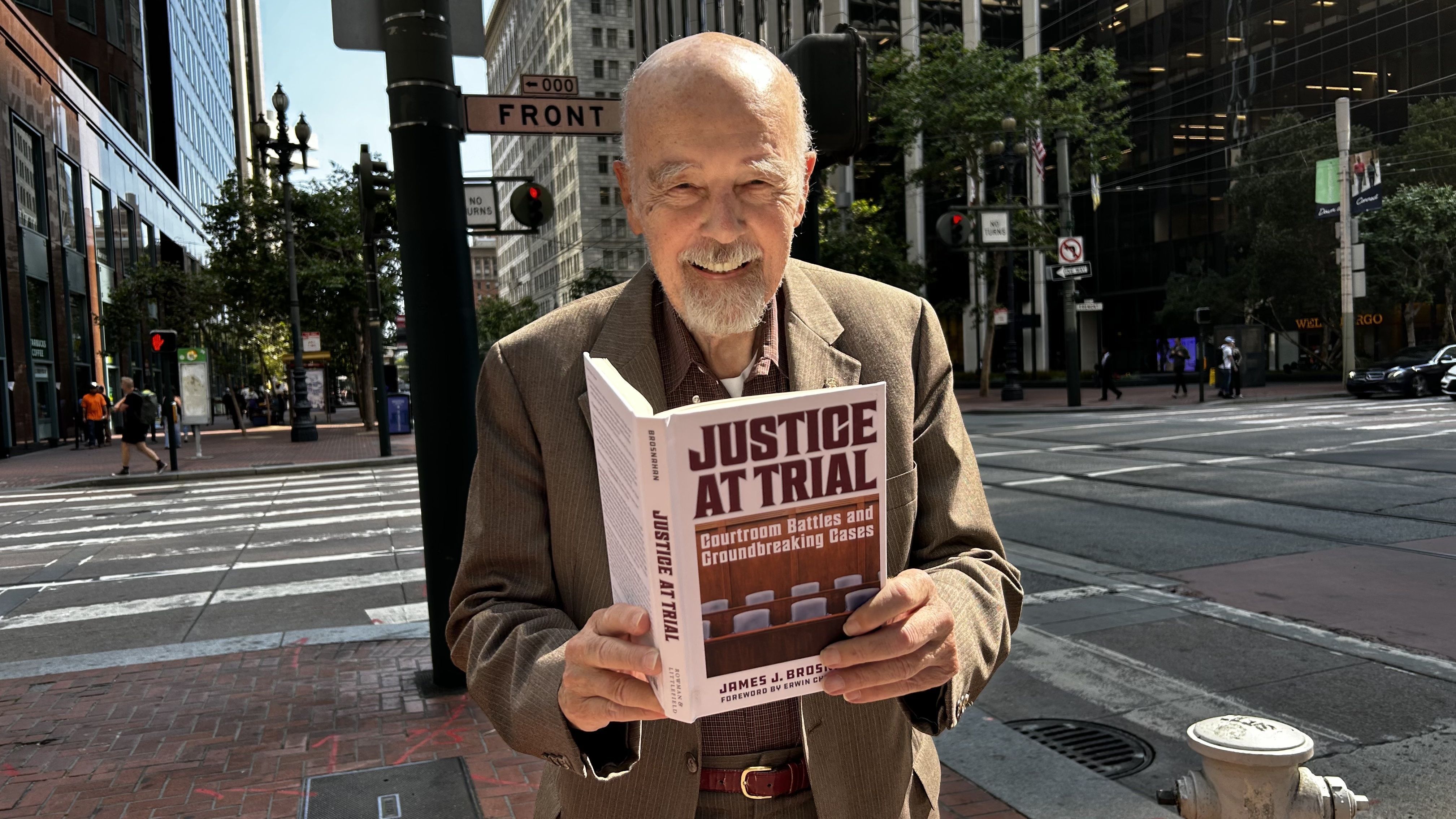 COURTROOM CRUSADER: Jim Brosnahan shows off his new book to our photographer  in downtown San Francisco last week