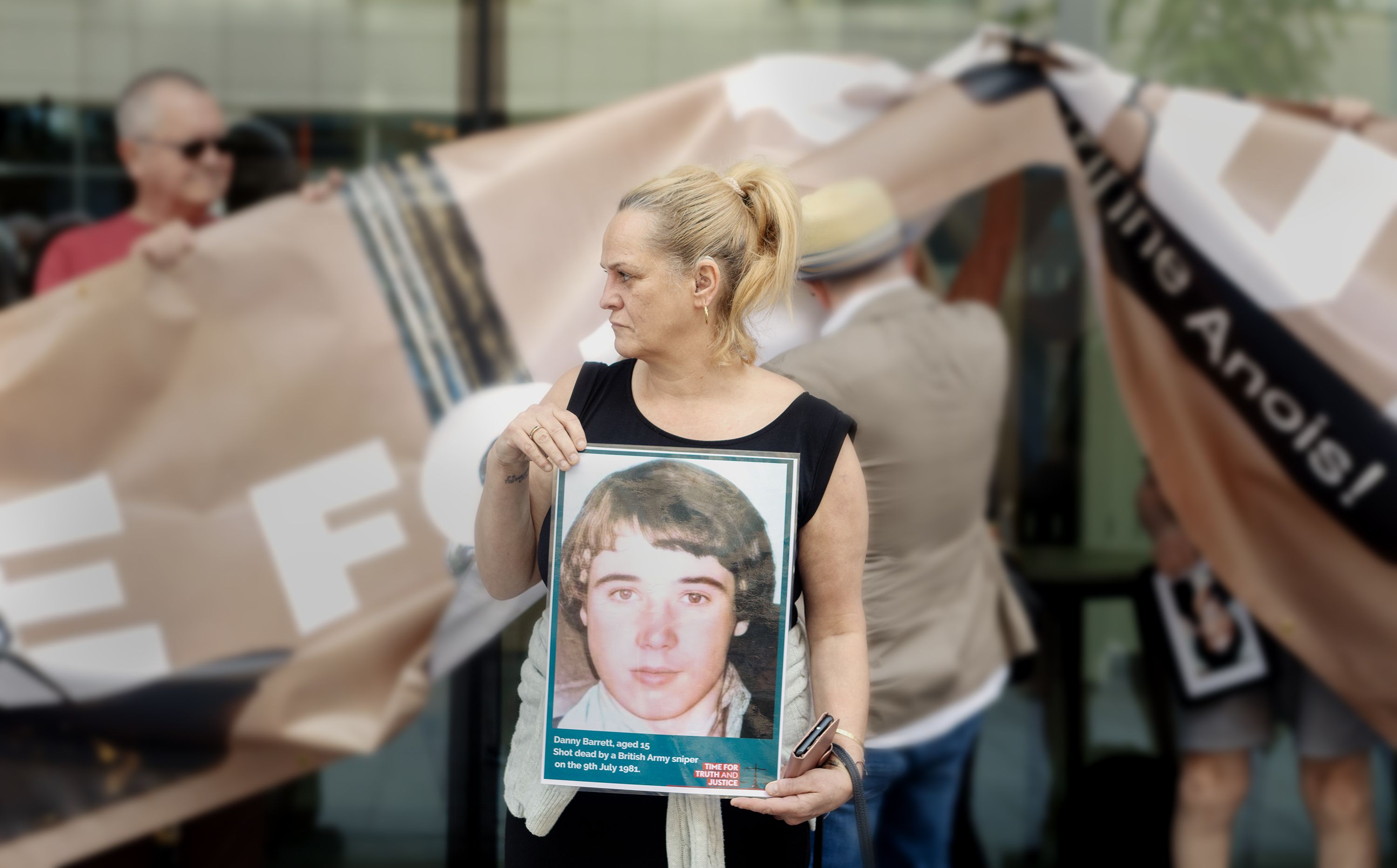 LEGACY: Tina Barrett holding a photo remembering her brother Danny who was 15 when he was murdered by the British Army in 1981