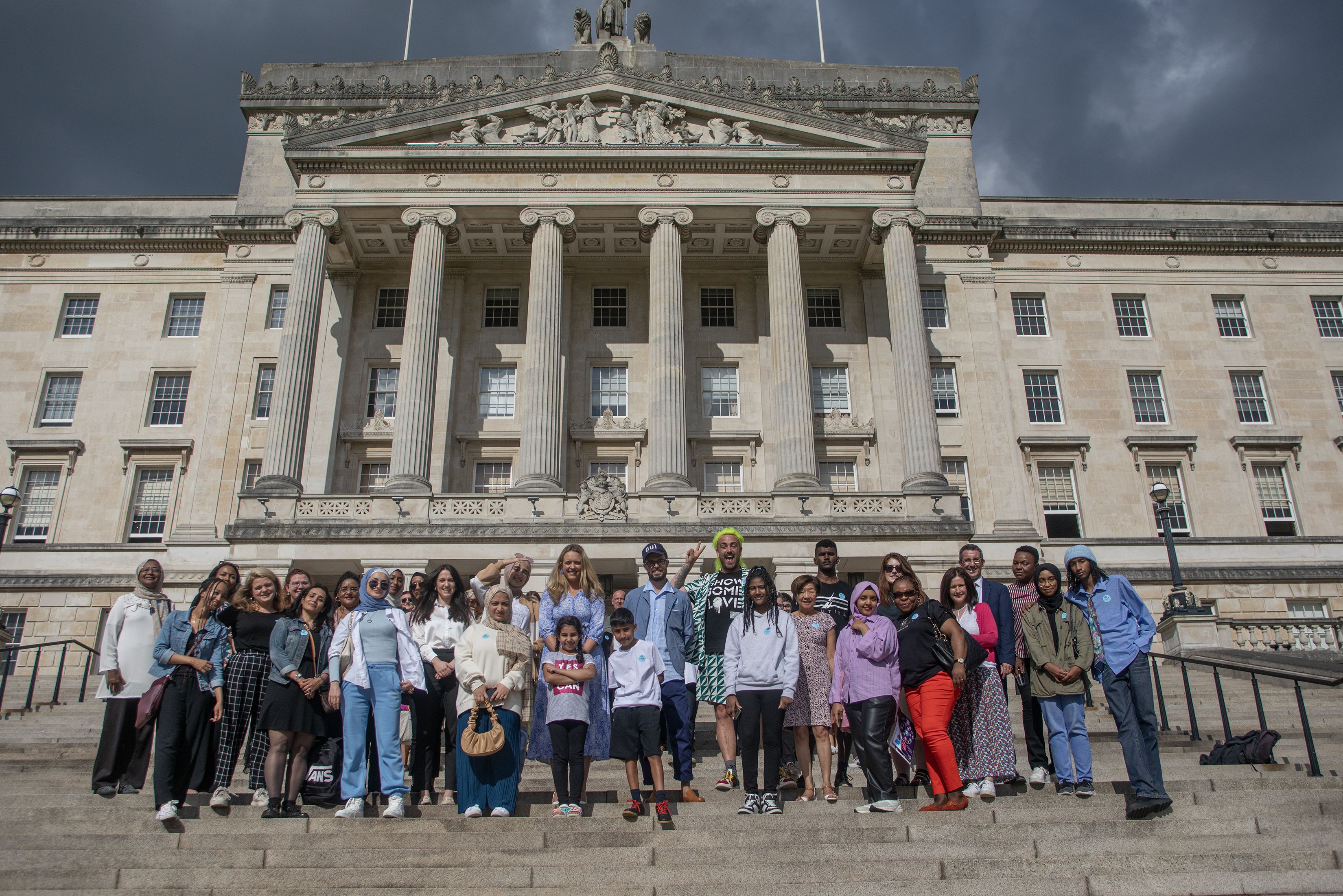 ART: Asylum seeker children with artist Oliver Jeffers, PPR, Anaka Women\'s Collective and Alliance Party reps outside Stormont