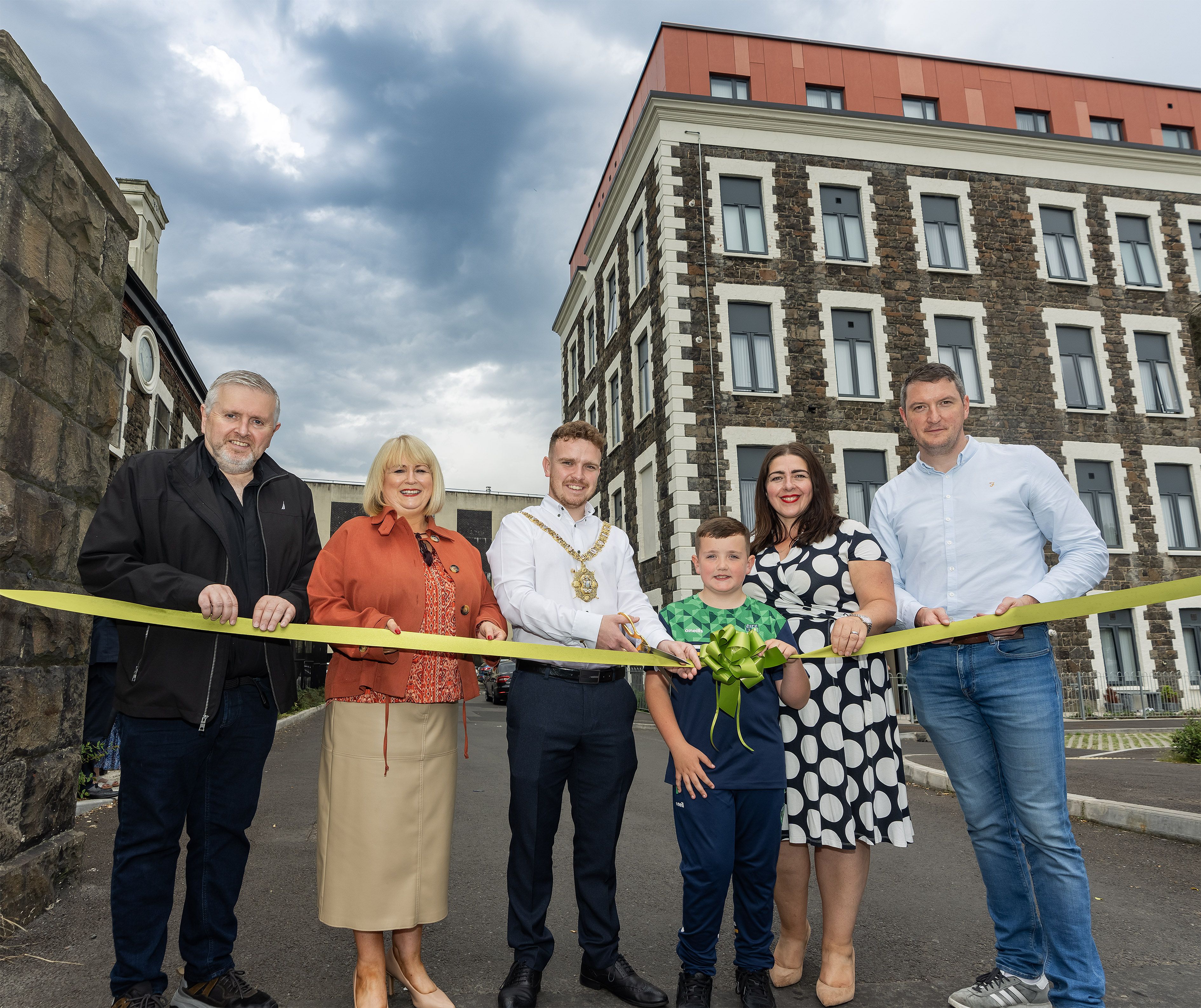 OFFICIAL OPENING: Fr Gary Donegan with Carol McTaggart, Group Chief Executive of Clanmil Housing; Lord Mayor of Belfast, Councillor Ryan Murphy, Lorcan Johnston; Maeve Monaghan, Chair of Clanmil Housing and John Finucane MP