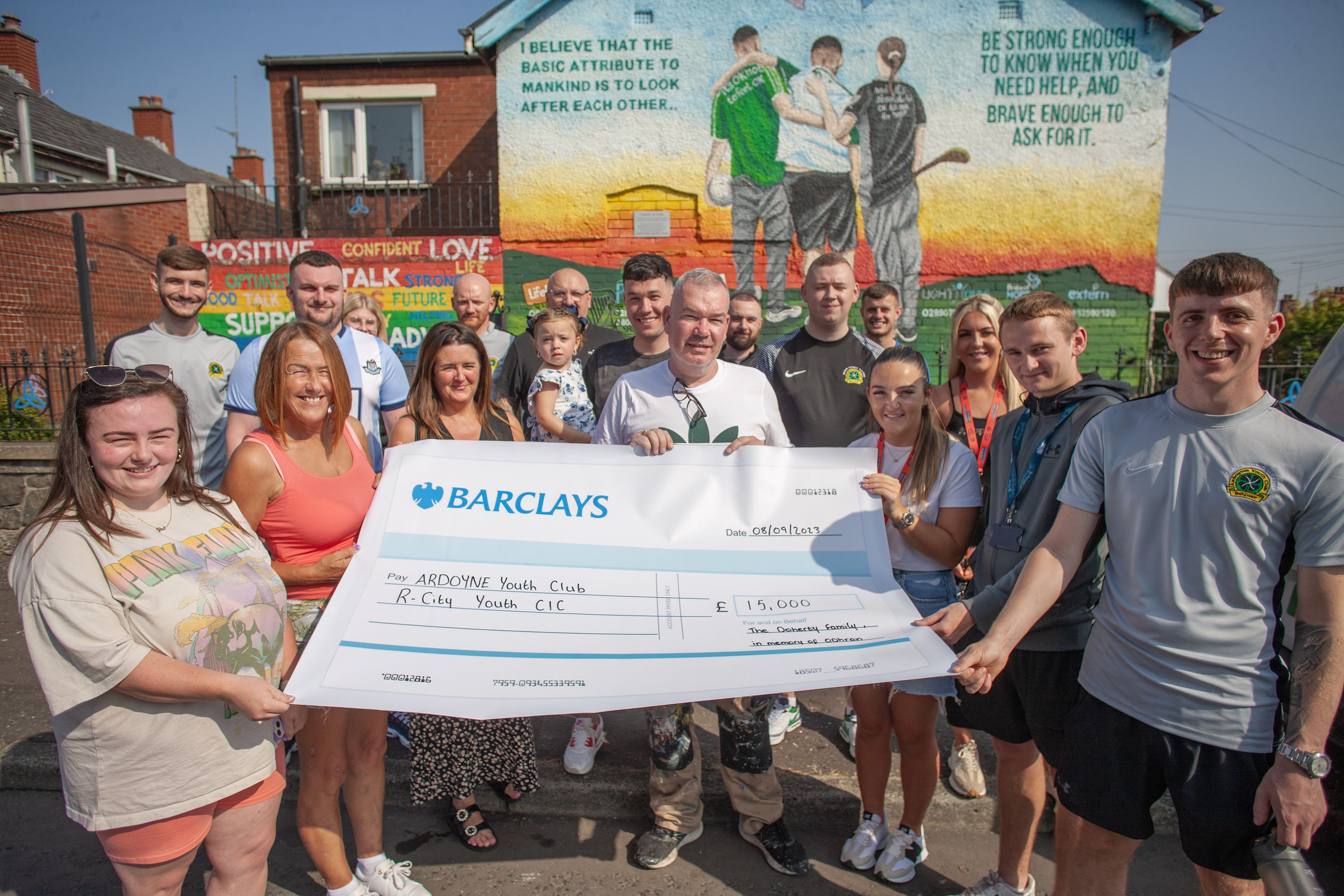 FUNDRAISING: Maureen and Michael Doherty present a cheque to Ardoyne Youth Club and R City for £15,000