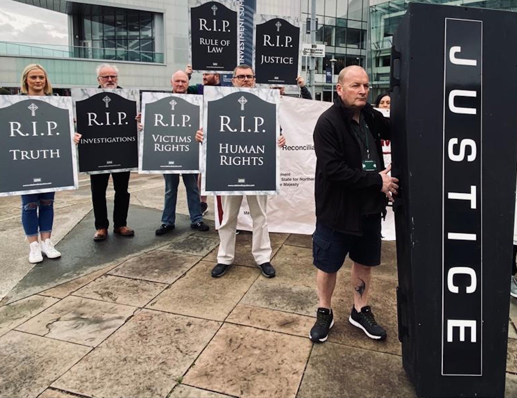 JUSTICE BURIED: Families of victims of the Troubles protested outside the Waterfront Hall on Wednesday against the British government\'s Legacy Bill during an investment summit