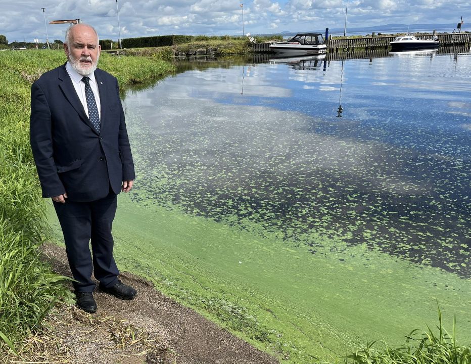 CRISIS: Mid-Ulster MP Francie Molloy on the banks of the algae-infested Lough Neagh