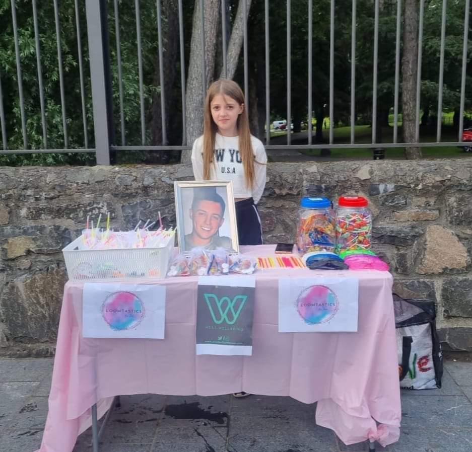 FUNDRAISING EFFORTS: Zoey Mateer (11) set up a stall outside the Falls Park during Féile an Phobail
