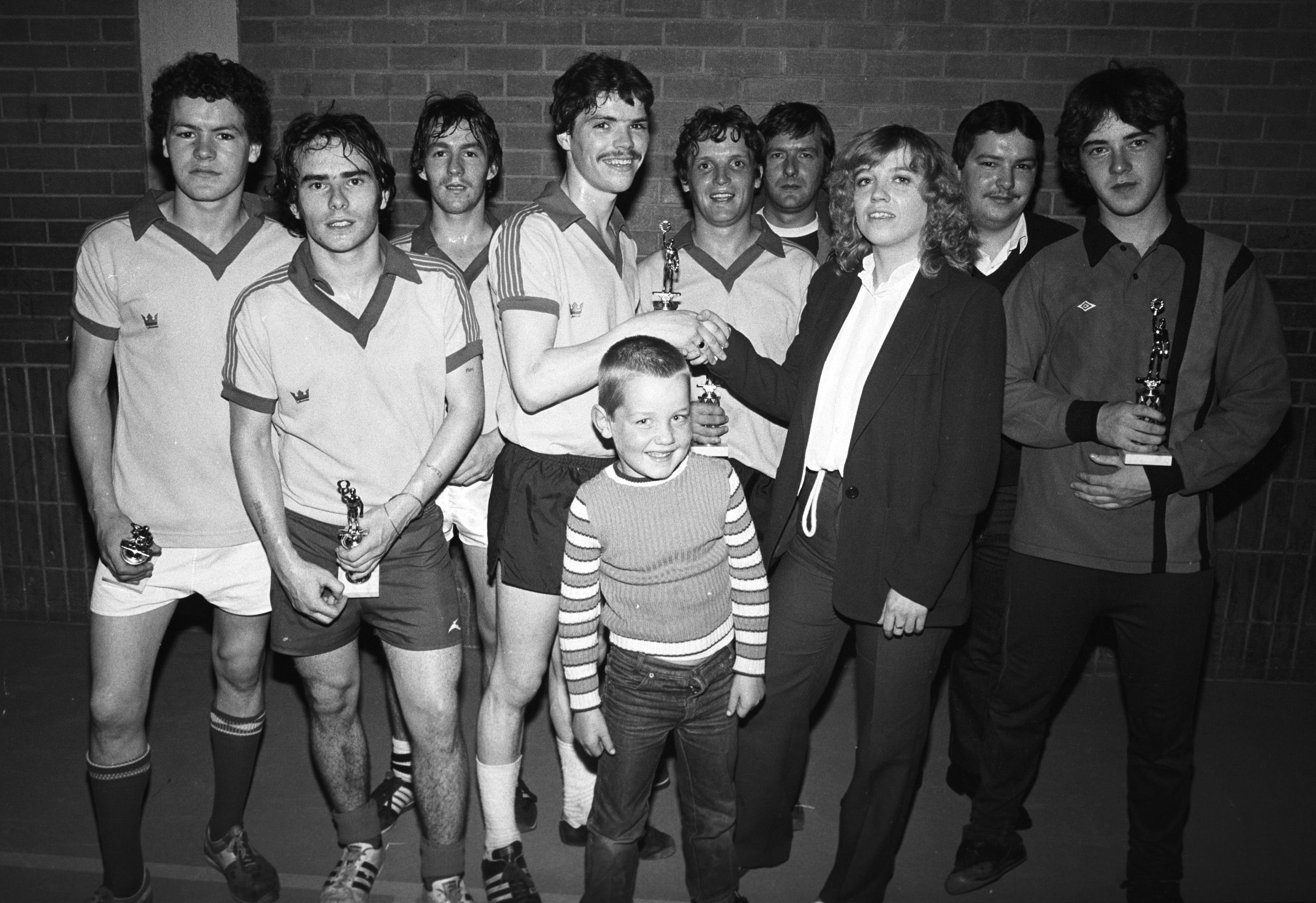 Carlisle Star winners, Tucker McCrudden, Whiz Casey, Ducky Campbell, Gerry Donnelly, Tootsy Barnes and John Donnelly receive their awards from Beechmount Leisure Centre assistant manager Mary Feeney after the five-a-side competition 