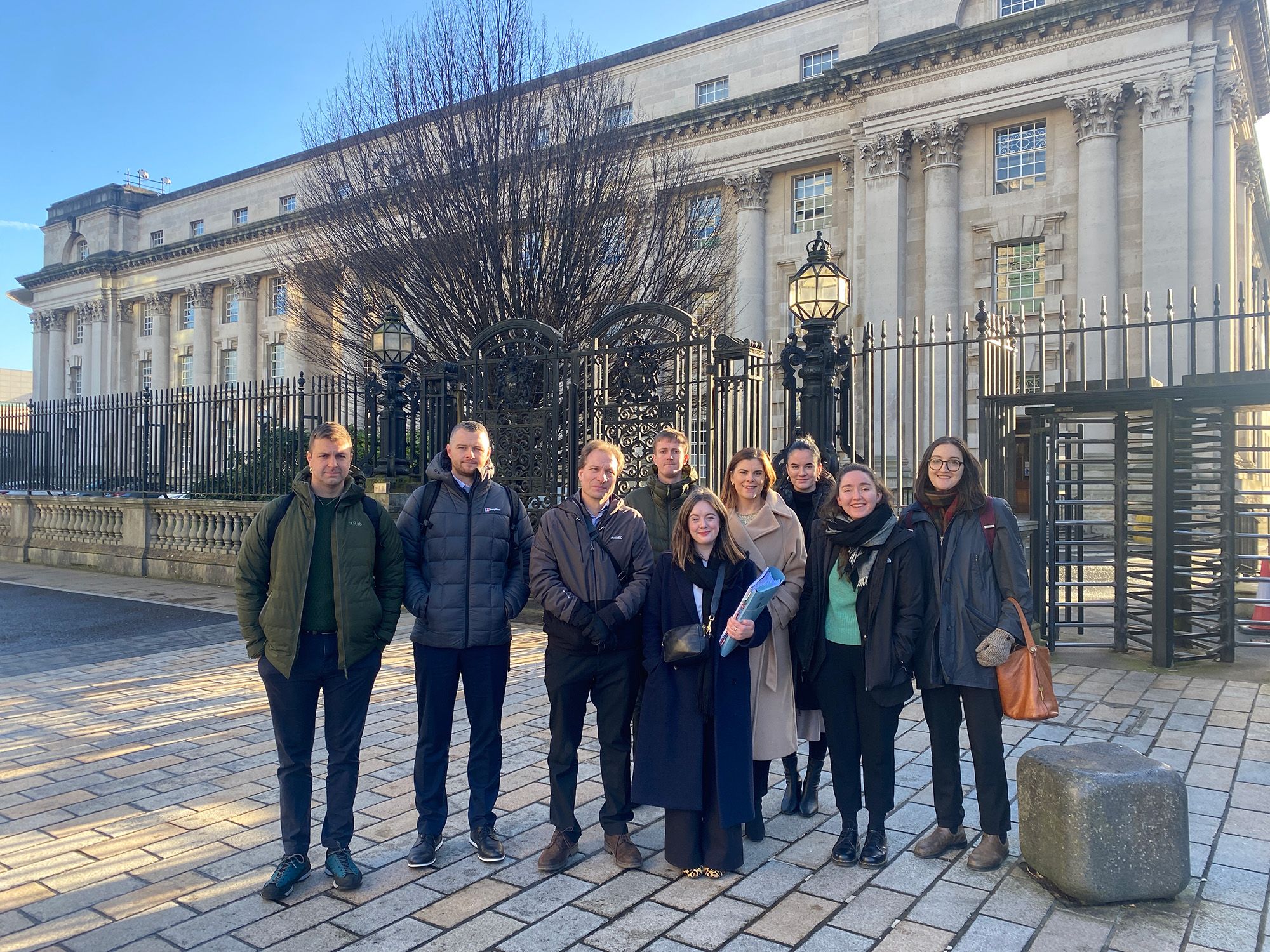 HISTORIC: Conradh na Gaeilge with CAJ, PILS and community witnesses outside the Royal Courts of Justice in Belfast