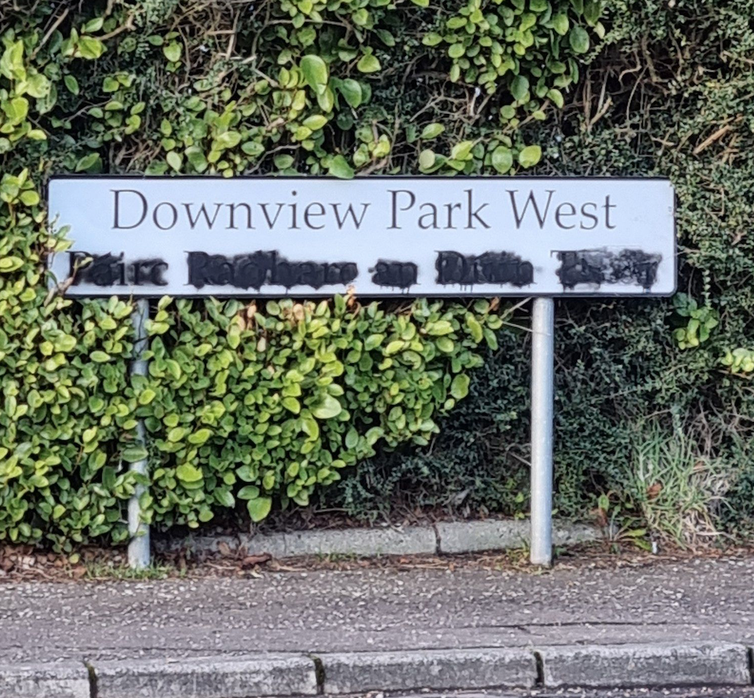 VANDALISED: The dual-language street sign at Downview Park West