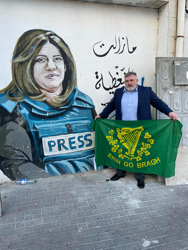 WEST BANK: Stephen Redmond in the West Bank beside a mural tribute to murdered journalist Shireen Abu Akleh