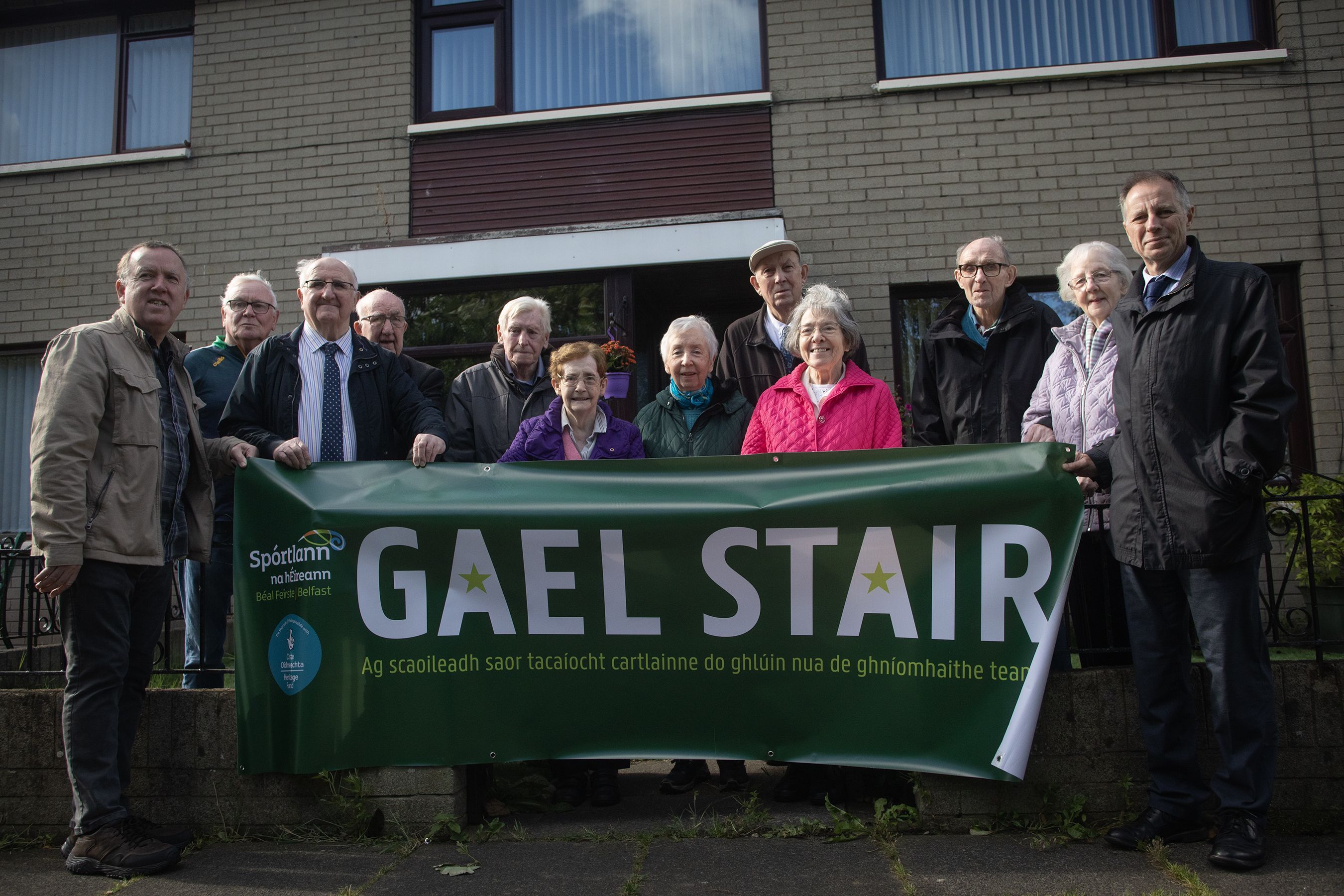 TOGETHER: Liam Ó Bruadair, third from right, at Bóthar Seoige last month with some of the other founders of the Shaws Road Gaeltacht