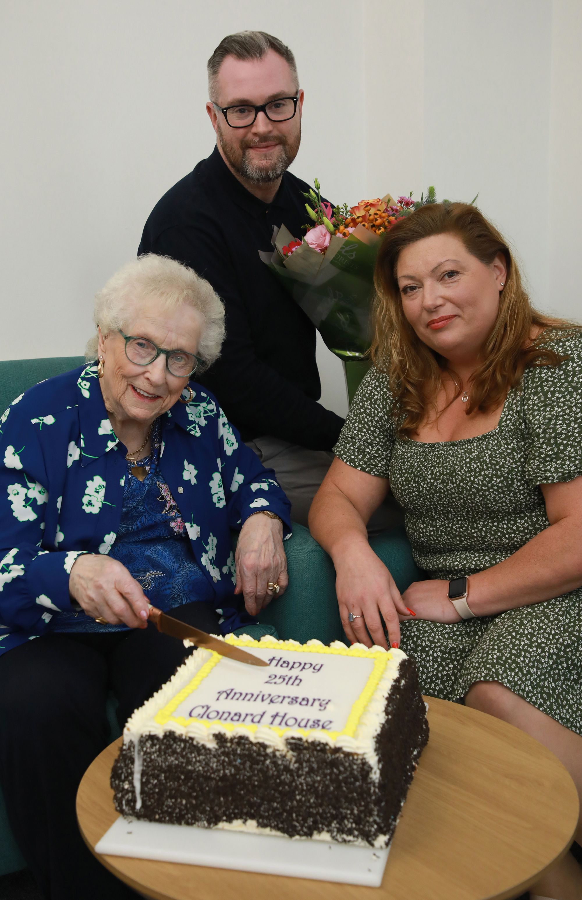 25TH ANNIVERSARY: Clonard House tenant Mrs Sally Taggart, Choice Housing Area Manager Stephen Adair, and Scheme Co-ordinator Cheryl Forsyth